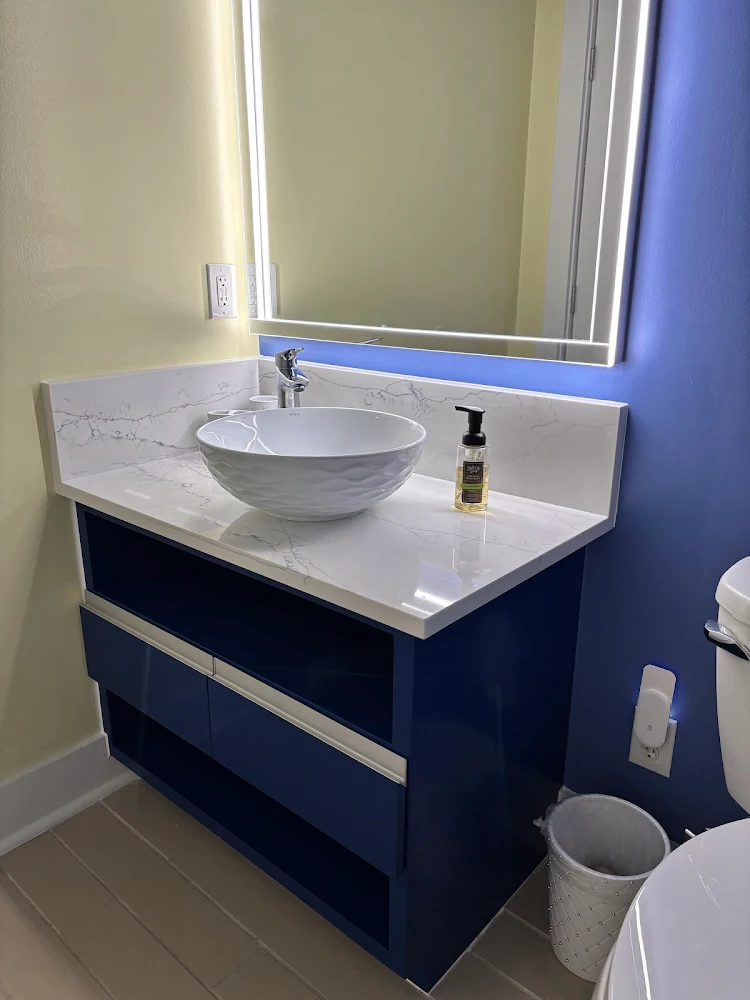 Modern European cabinets with vessel sinks.