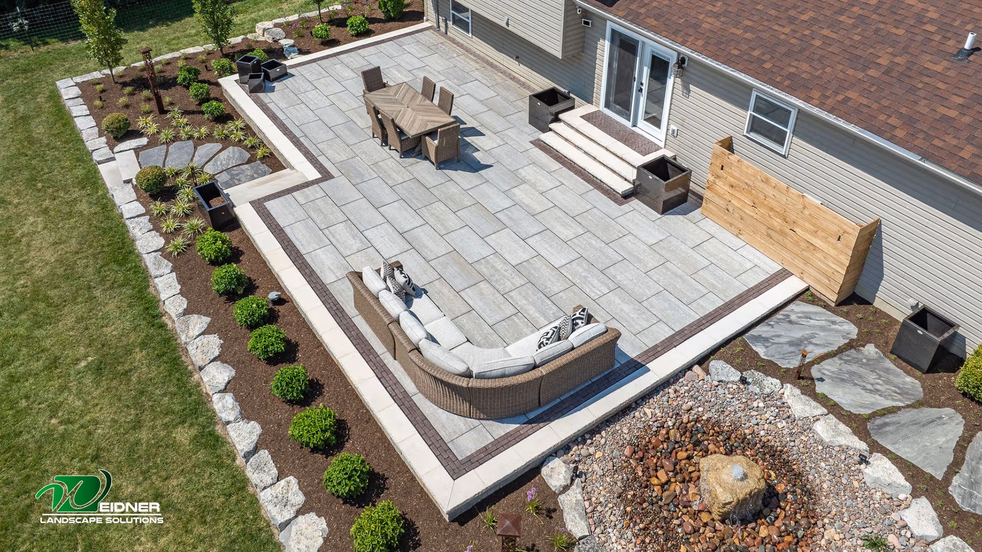 Custom landscape design with plant beds and lawn layout by Weidner Landscape Solutions in Englewood, Ohio