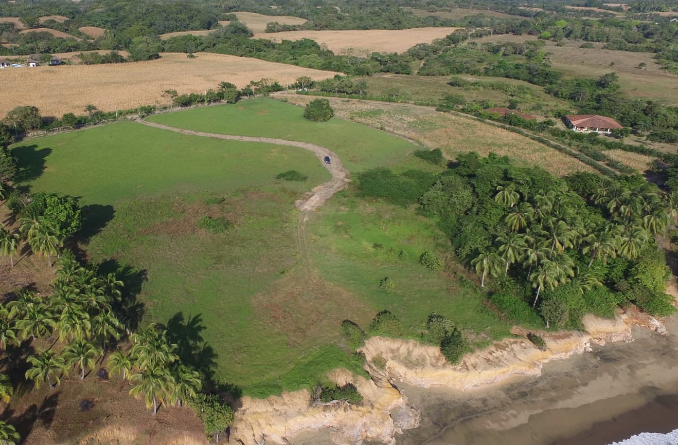 coastal land development in Pedasi Panama aerial view showing green landscape and oceanfront terrain