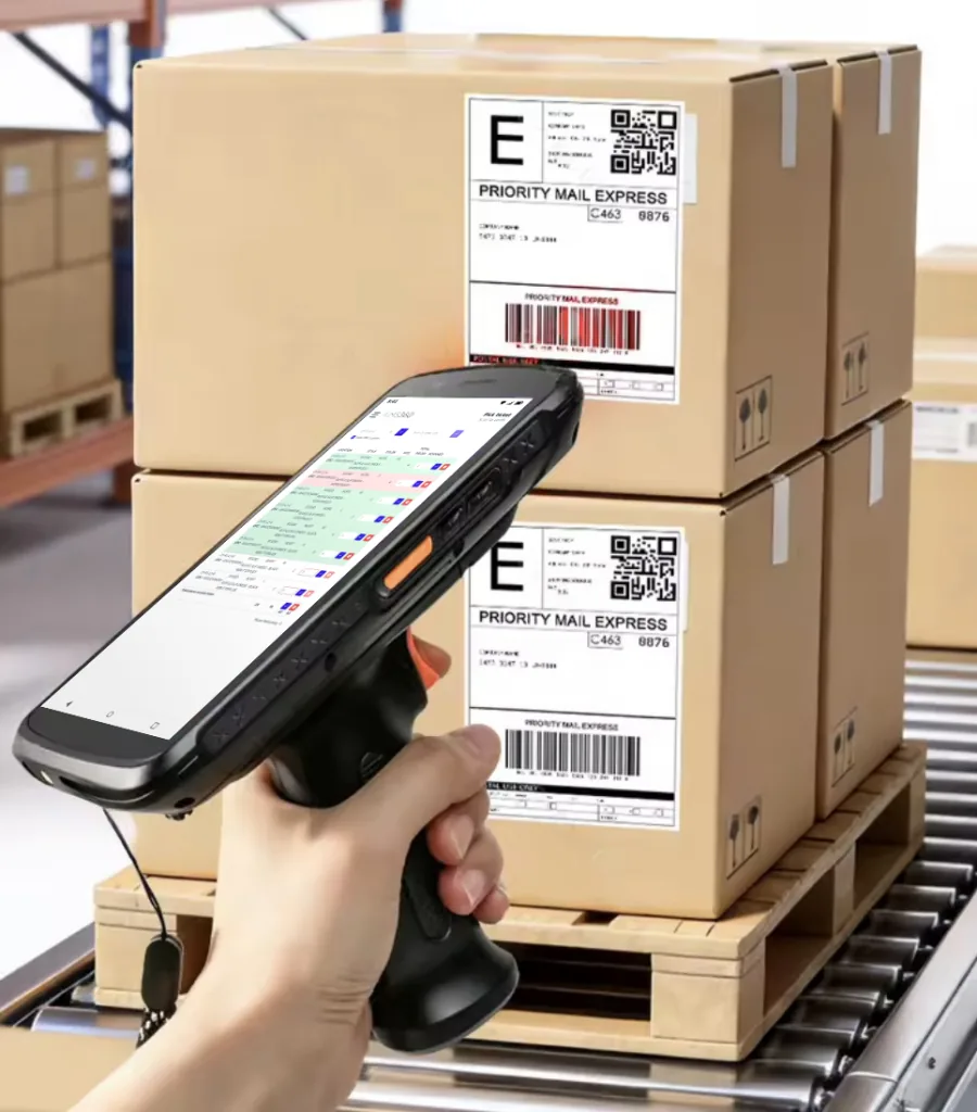 Warehouse picker scanning a carton label with a rugged pistol grip handheld running AIMS360 Runway scan to verify on a pick ticket