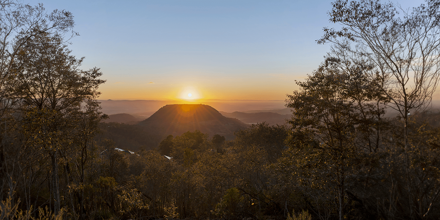 The sun setting over the mountains.