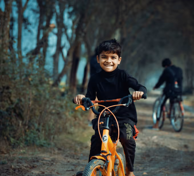kid riding bicycle