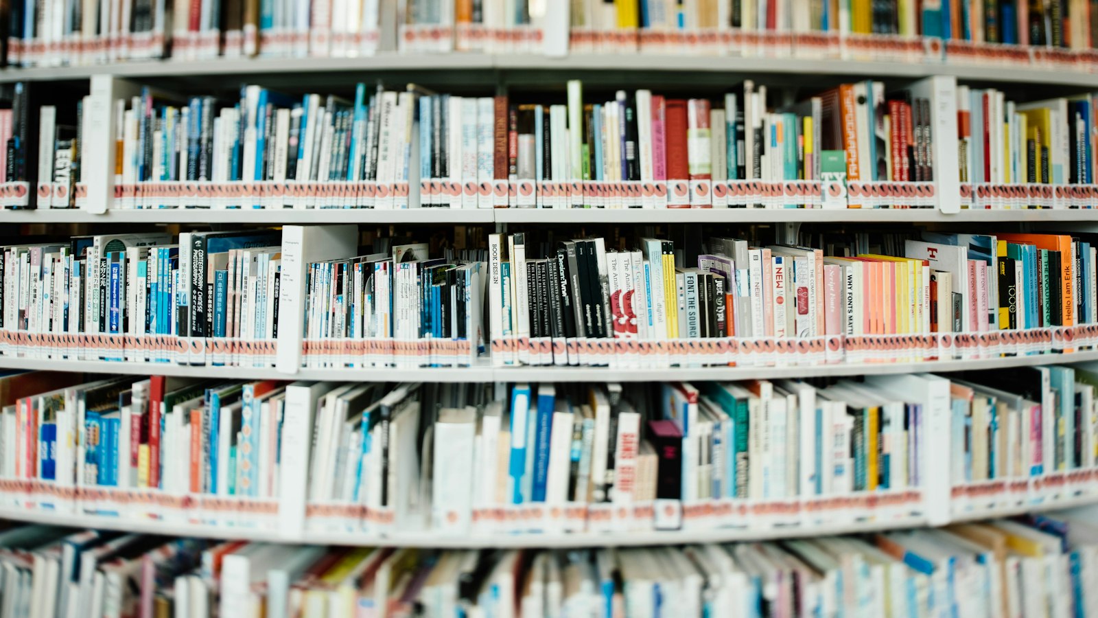 Stacks of books on library shelves