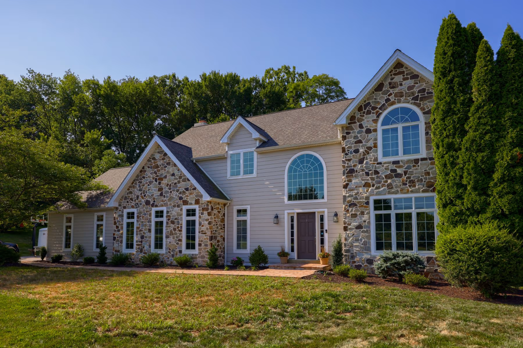 Stone Veneer installation and restoration on a home in Kennett Square, PA, done by Smucker Exteriors & Remodeling