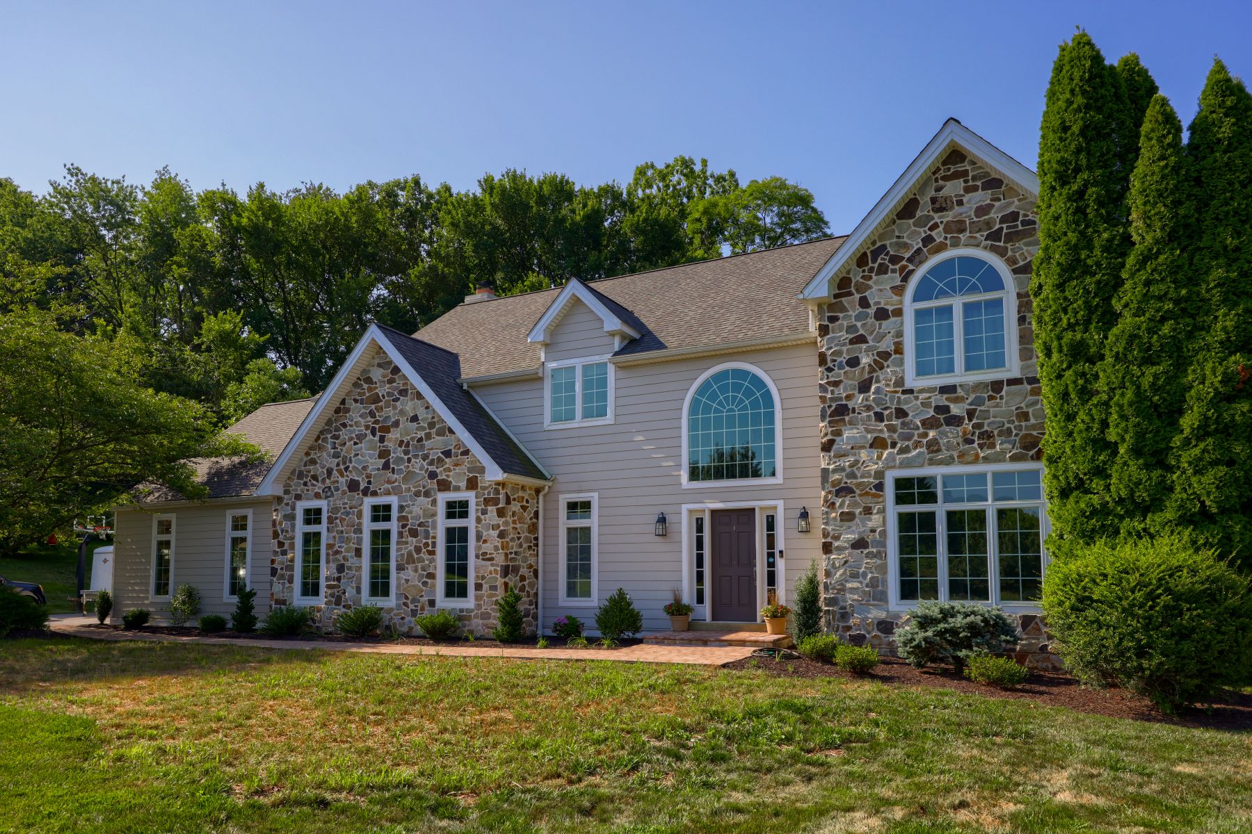 Stone Veneer installation and restoration on a home in Kennett Square, PA, done by Smucker Exteriors & Remodeling
