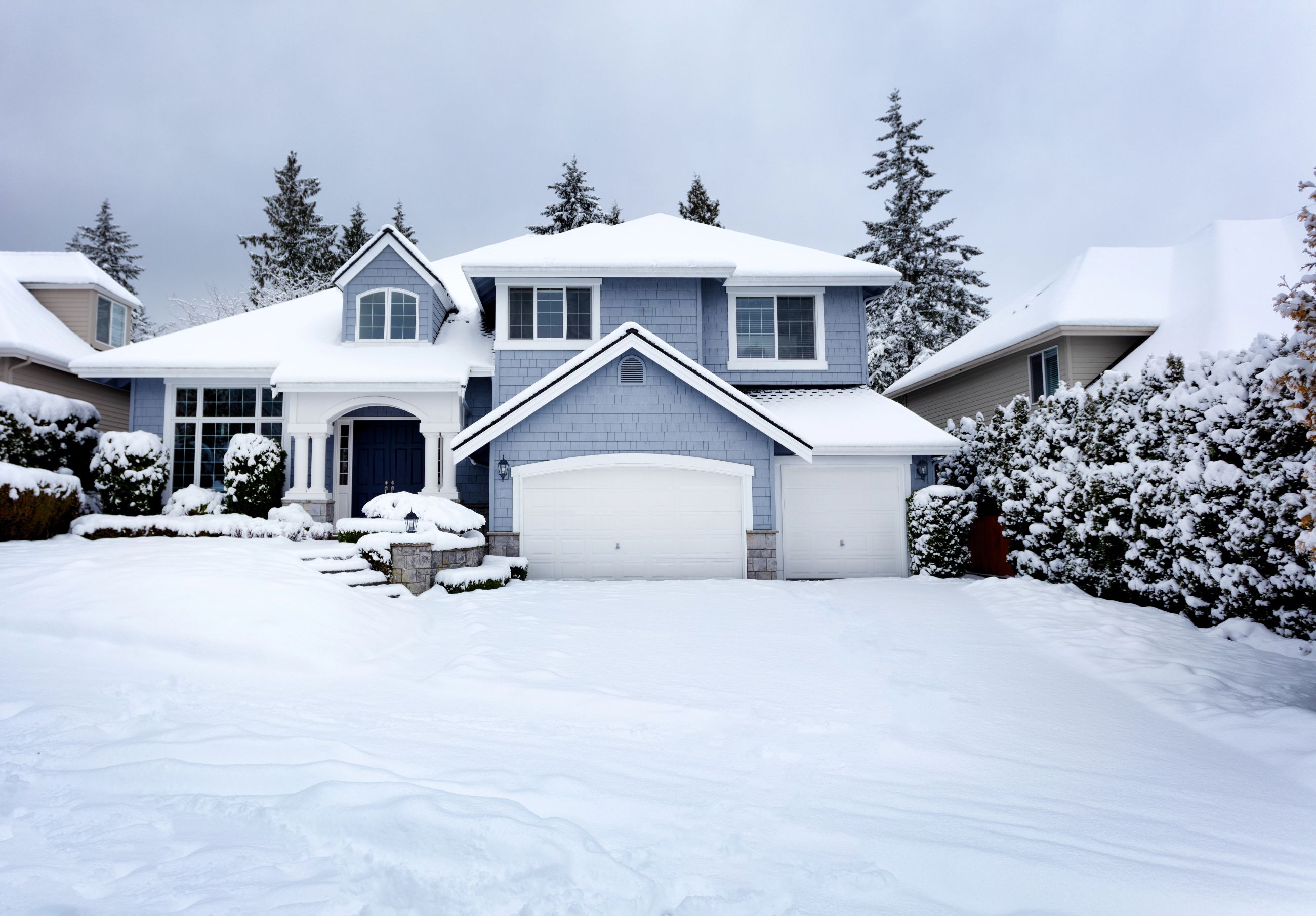 Home in PA covered with snow on shingle roof in winter. How to prep you home for the upcoming winter.