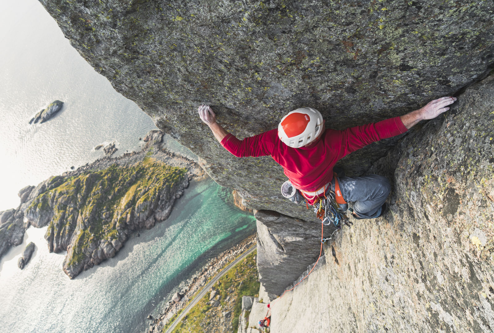 Climber on the West Pillar of Presten above the Norwegian Sea
