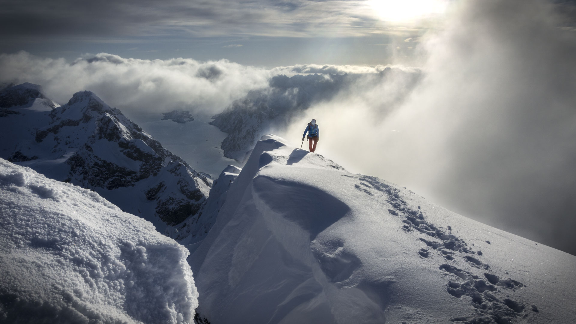 Winter alpine climbing above the sea in Lofoten