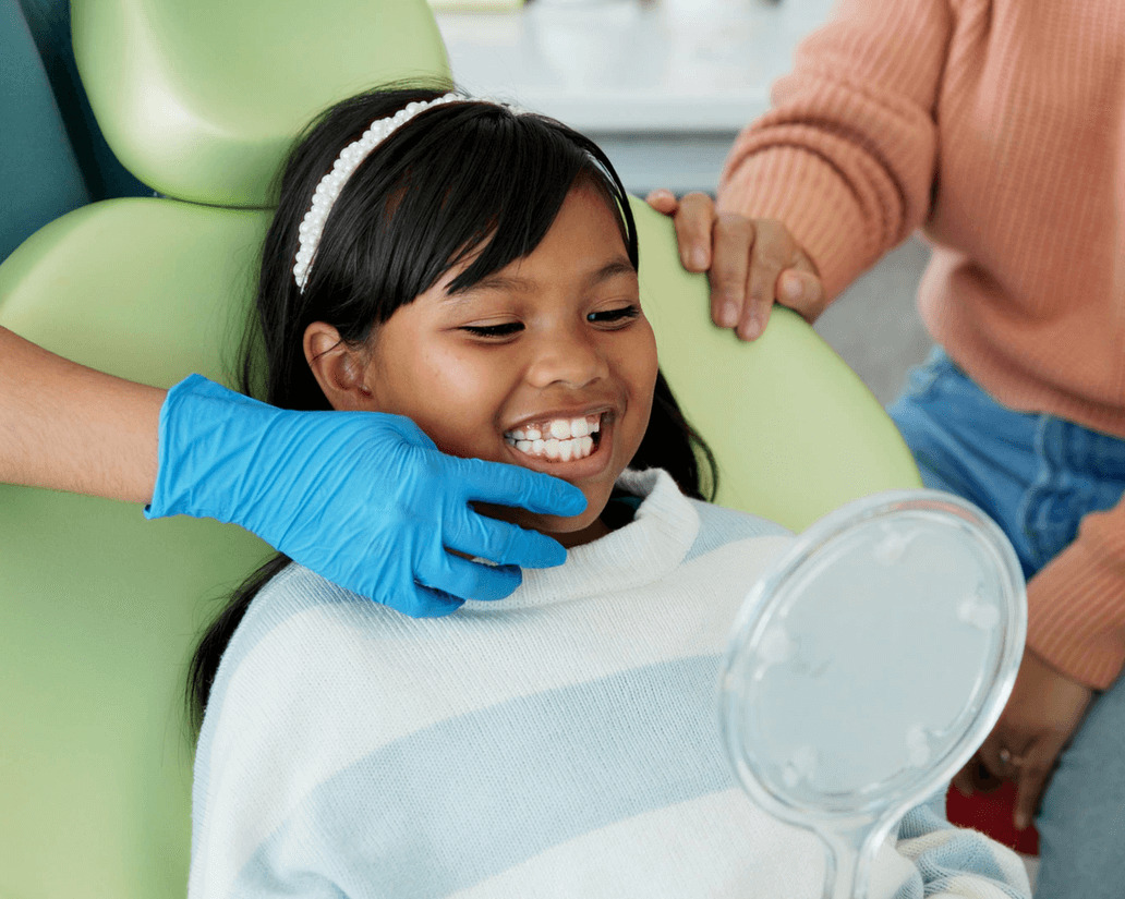 A seven-year-old girl visits the orthodontist in West LA for the first time for her first early orthodontic appointment