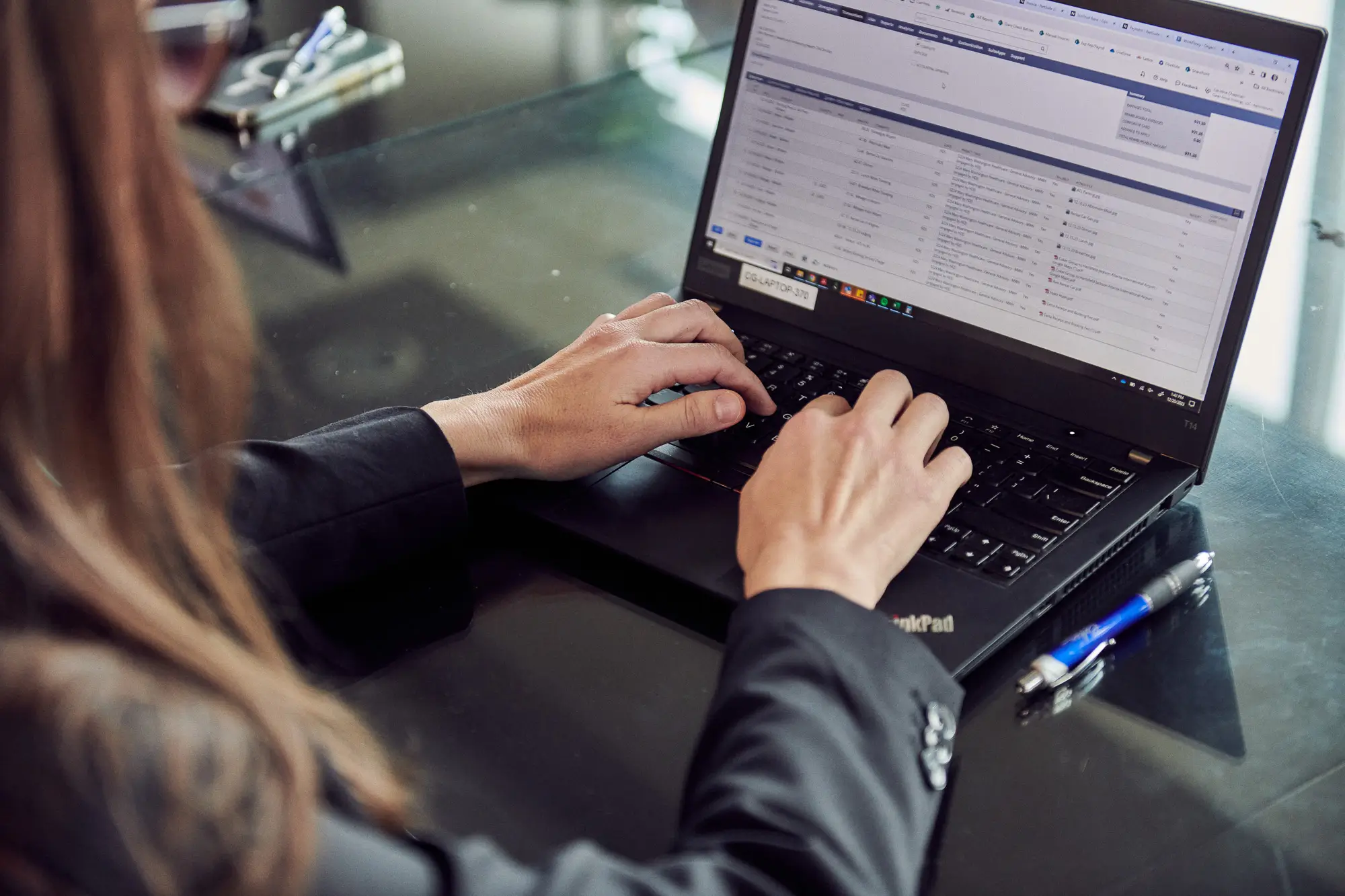 Employee working on a laptop.