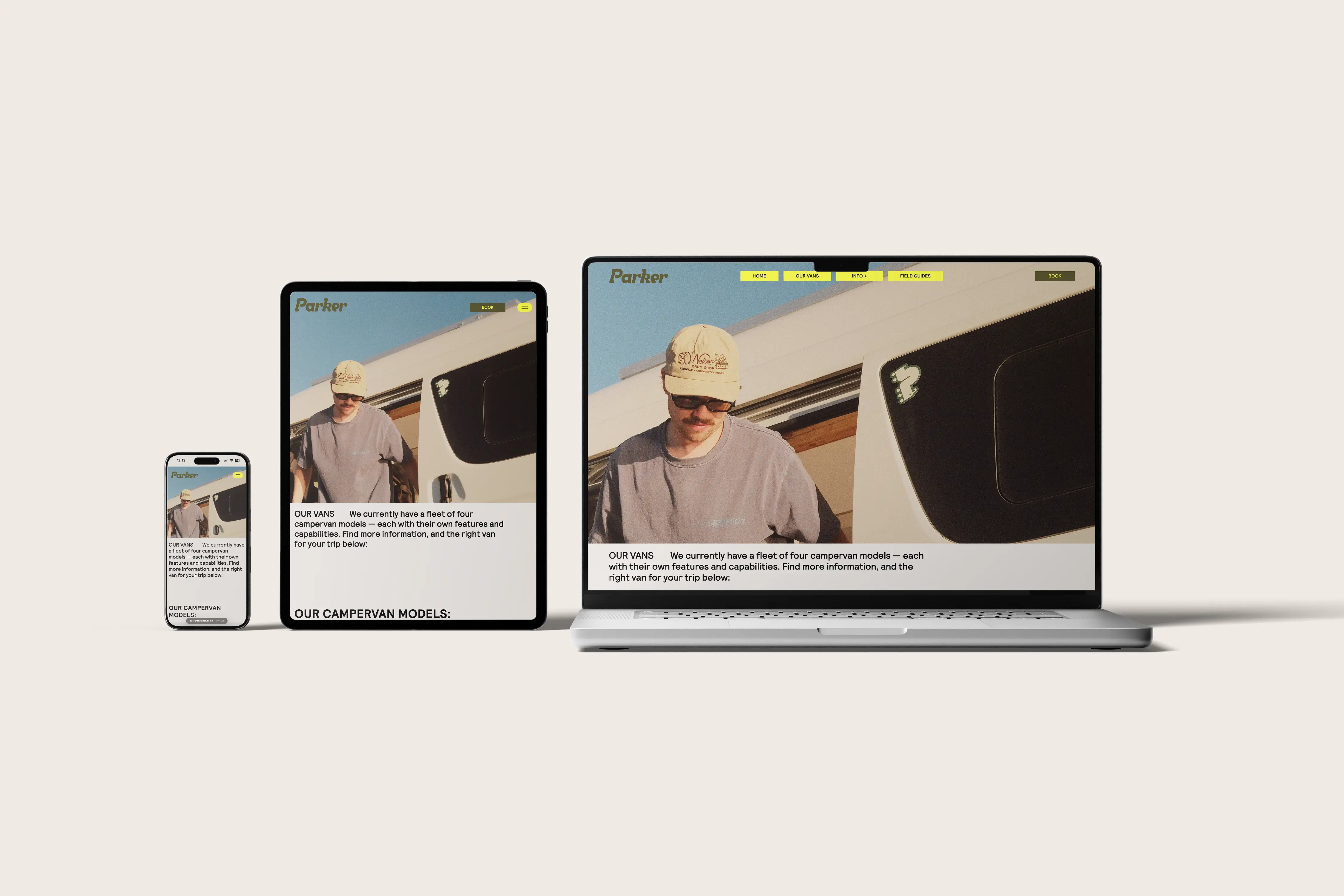Website showing a man by a campervan displayed on a phone, tablet, and laptop screen.
