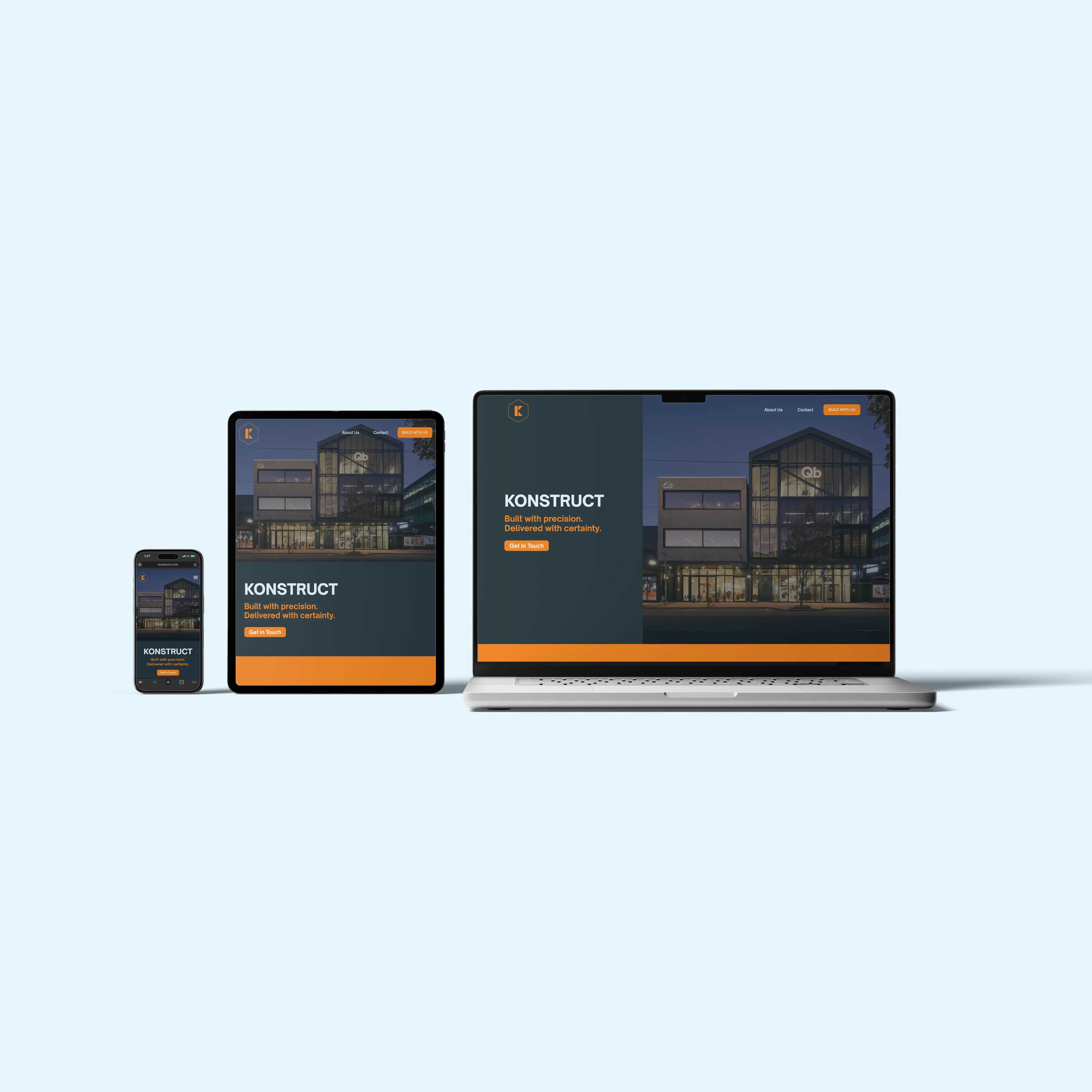 Mobile, tablet, and laptop displaying a website for Konstruct with a building photo and orange highlights.