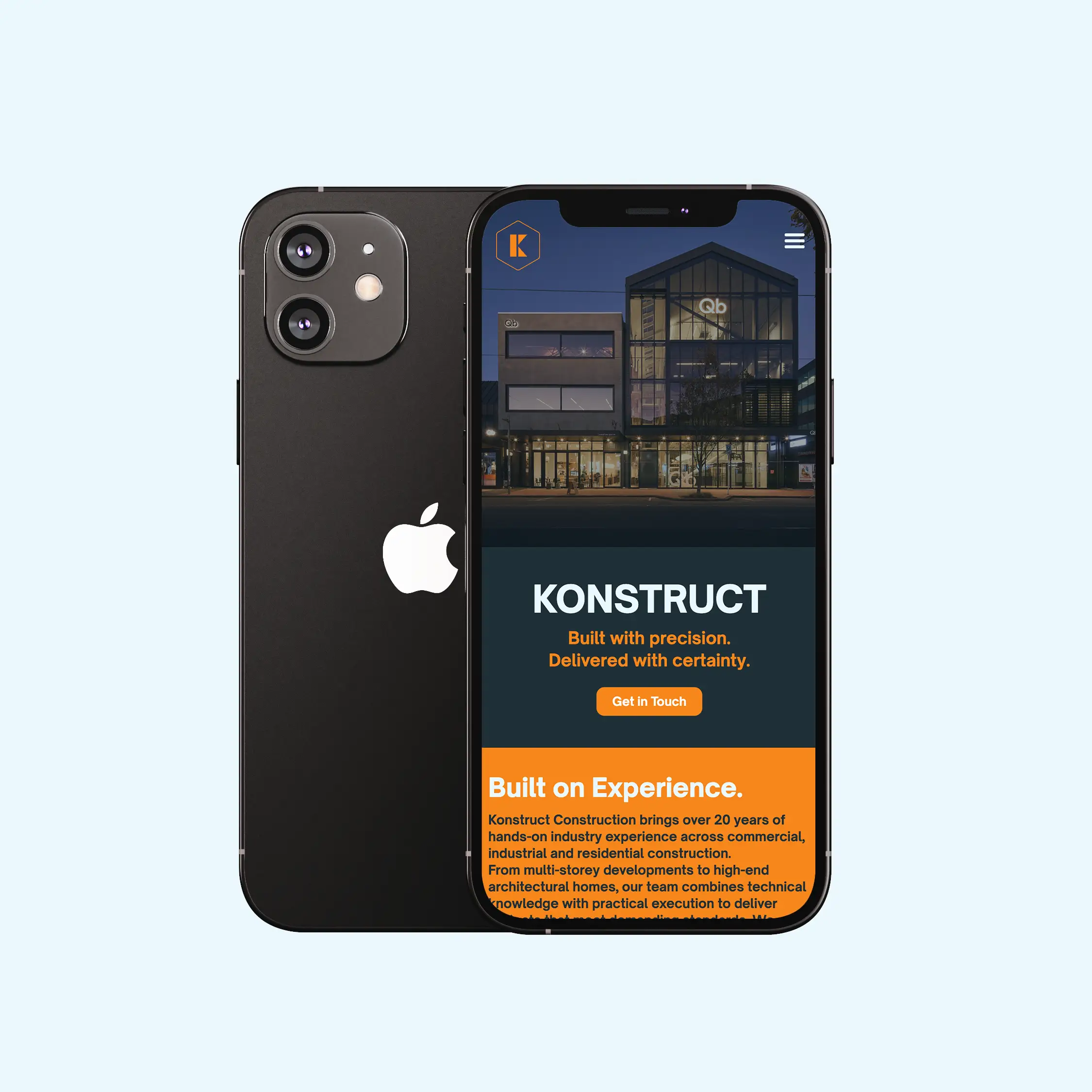 Black iPhone showing Konstruct construction website with building image and text about experience.