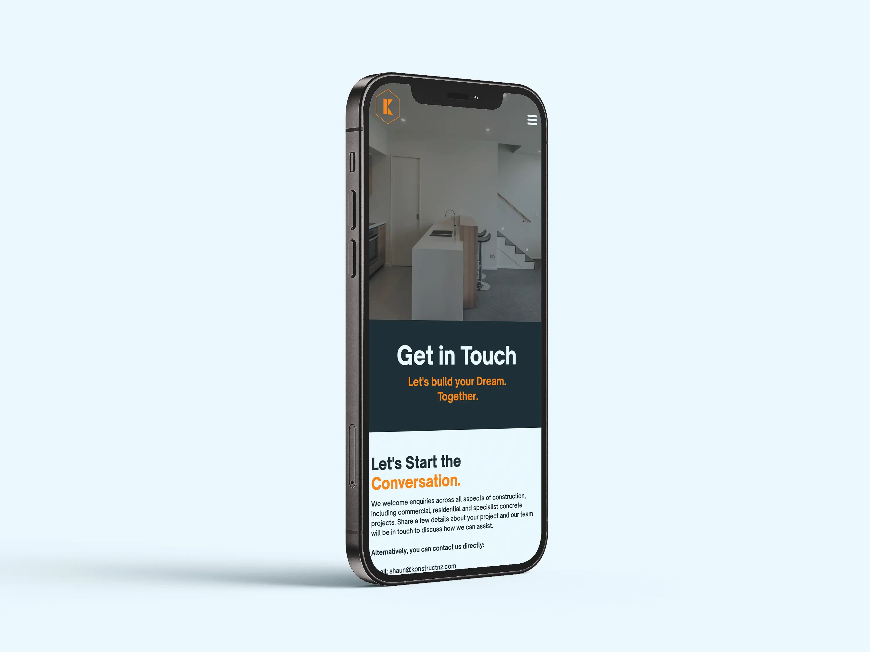 Smartphone showing a contact page with 'Get in Touch' and construction project inquiry text.