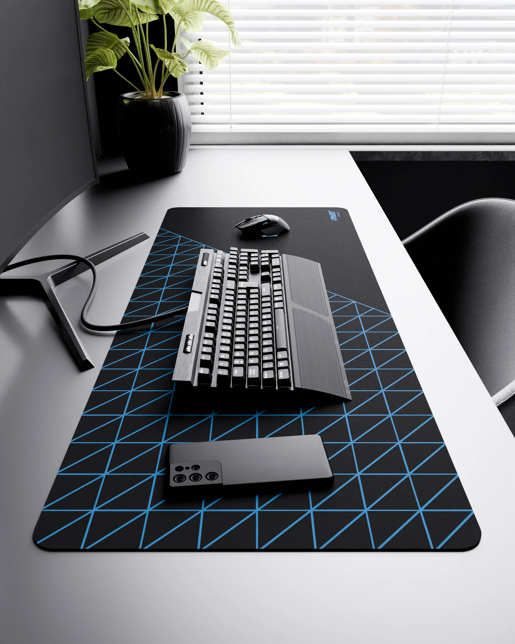 Side view of Night Sky Grid Runner XXL deskmat 1000mm x 400mm right-handed layout on minimalist desk with gaming accessories, featuring blue geometric grid pattern, water-resistant easy-to-clean surface, ultra-lightweight and odour-free base.