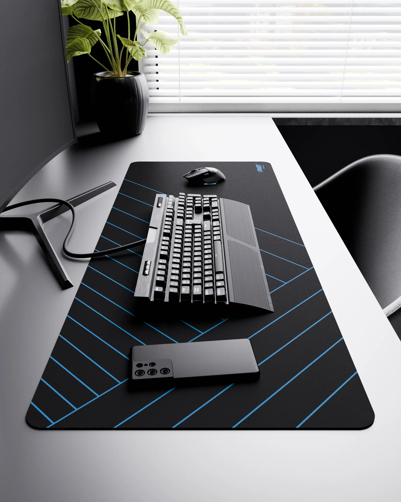 Side view of Night Sky Zebra XXL deskmat 1000mm x 400mm right-handed layout on minimalist desk with gaming accessories, featuring blue diagonal stripe pattern, water-resistant easy-to-clean surface, ultra-lightweight and odour-free base.