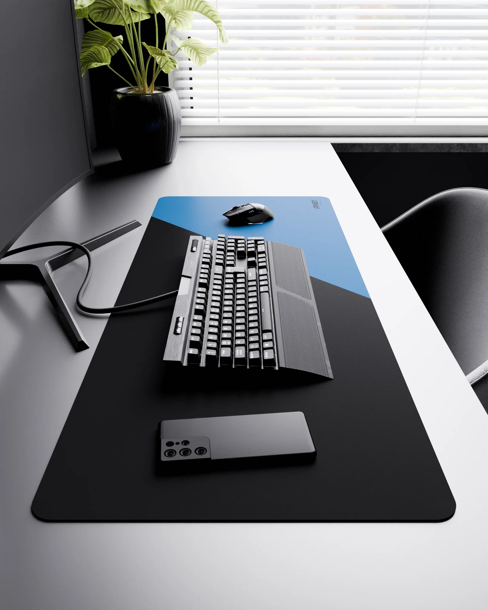 Side view of Sky Edge Runner XXL deskmat 1000mm x 400mm right-handed layout on minimalist desk with gaming accessories, featuring blue diagonal split design, water-resistant easy-to-clean surface, ultra-lightweight and odour-free base.
