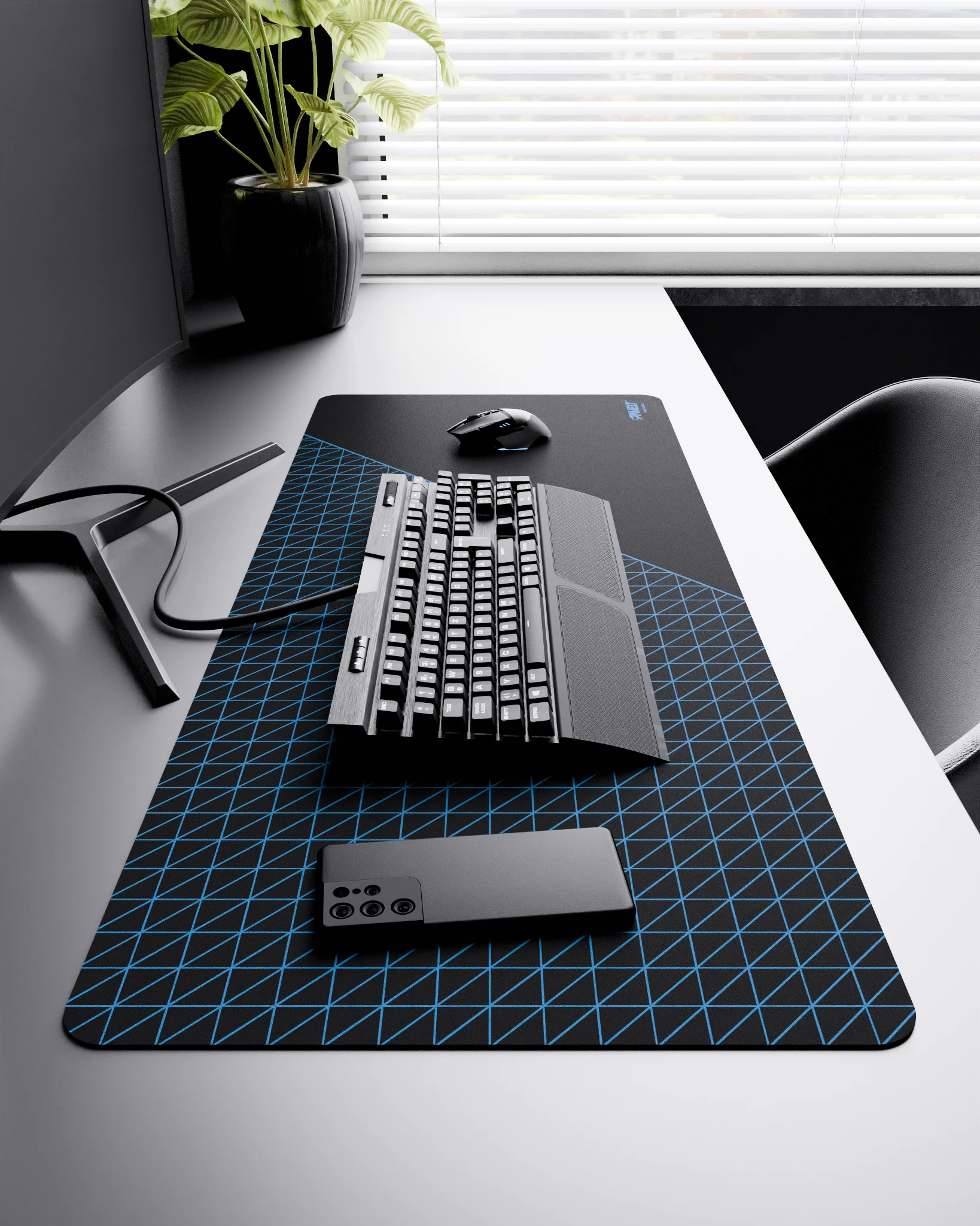 Side view of Night Sky Net Runner XXL deskmat 1000mm x 400mm right-handed layout on minimalist desk with gaming accessories, featuring blue dense geometric net pattern, water-resistant easy-to-clean surface, ultra-lightweight and odour-free base.