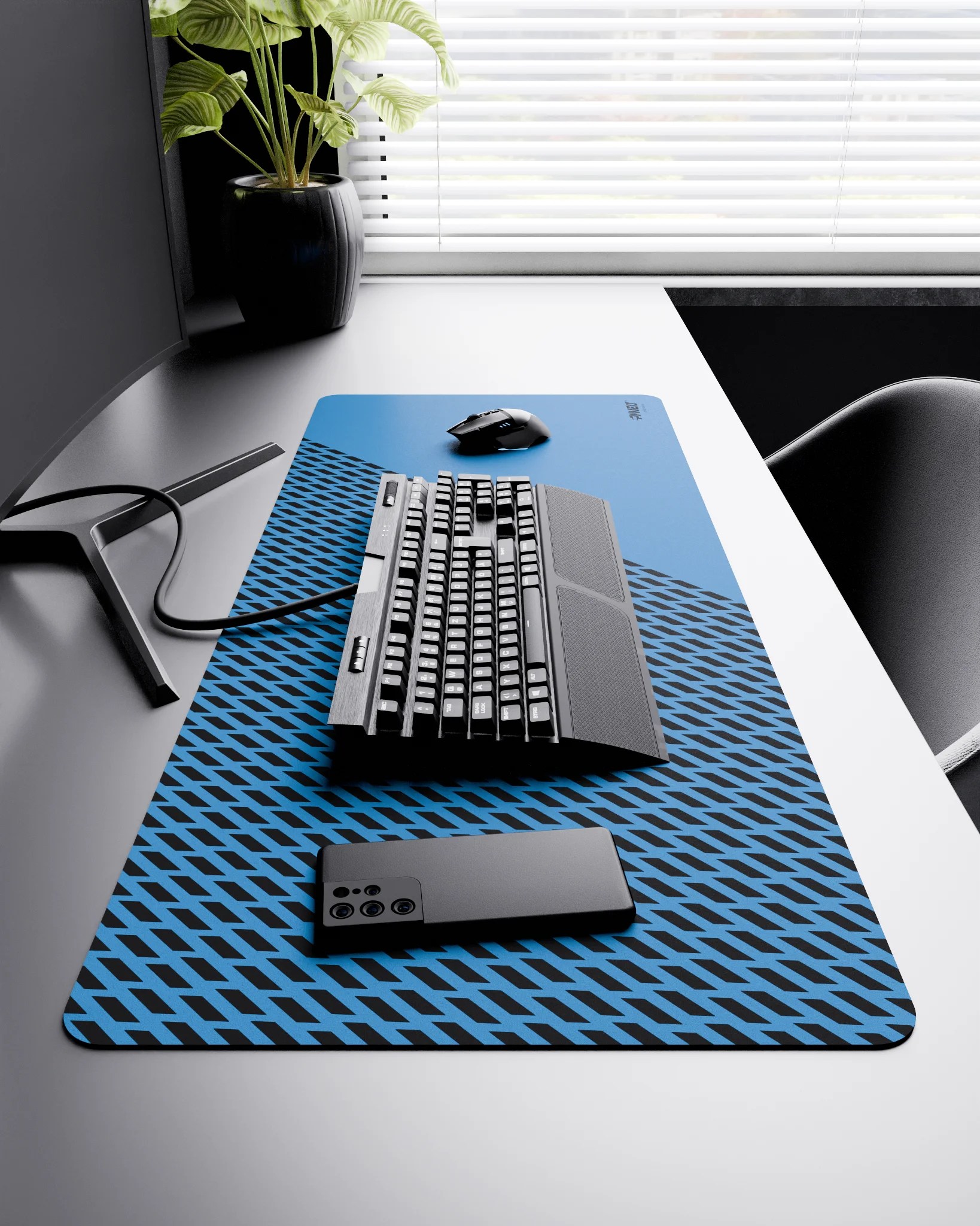 Side view of Sky Panther XXL deskmat 1000mm x 400mm right-handed layout on minimalist desk with gaming accessories, featuring blue diagonal split design with geometric panther spot pattern, water-resistant easy-to-clean surface, ultra-lightweight and odour