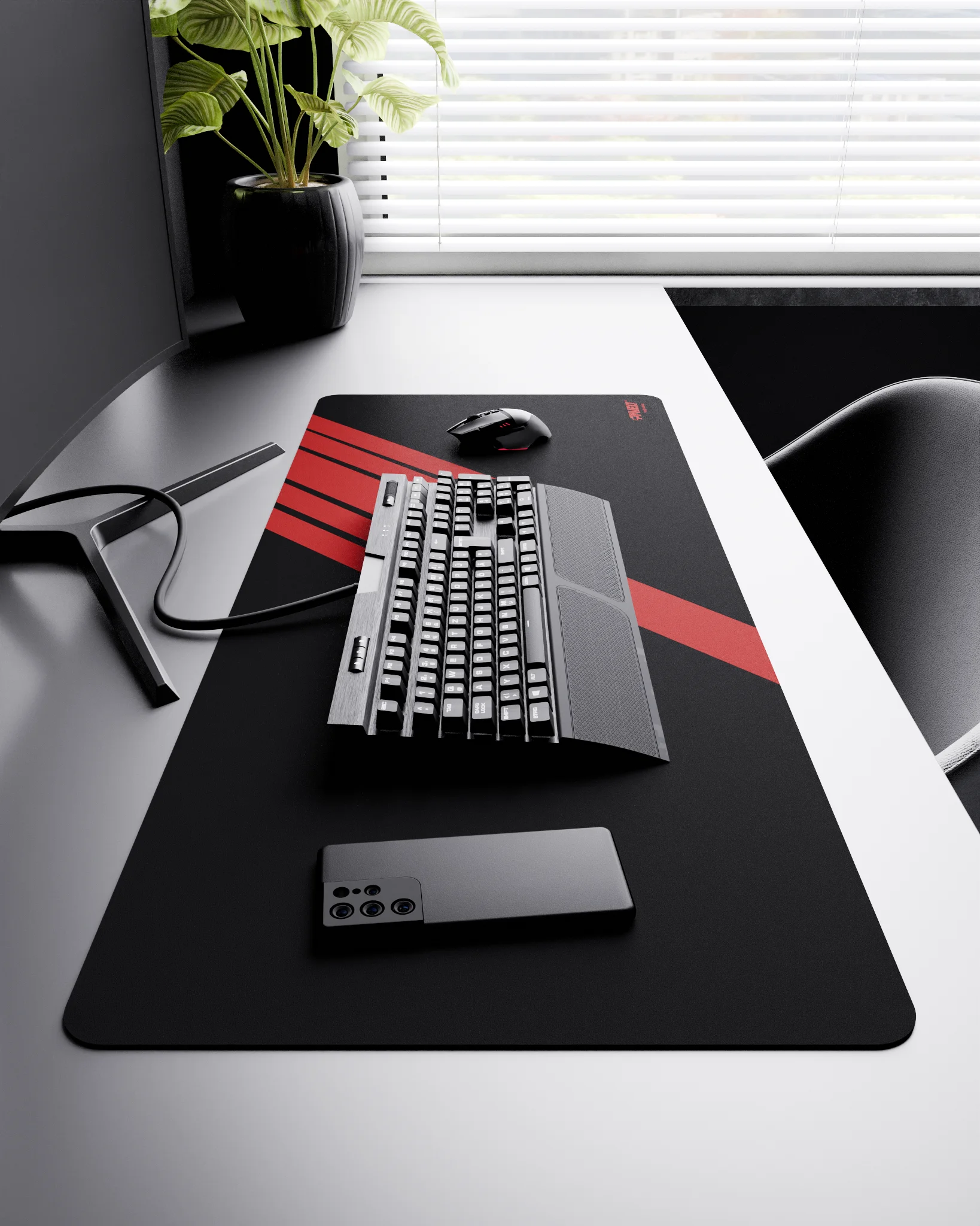 Side view of Night Imperial Blade Runner XXL deskmat 1000mm x 400mm right-handed layout on minimalist desk with gaming accessories, featuring red diagonal stripe design, water-resistant easy-to-clean surface, ultra-lightweight and odour-free base.