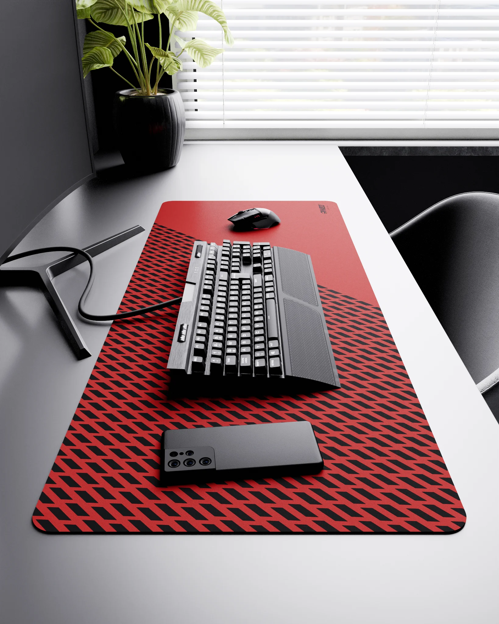 Side view of Imperial Panther XXL deskmat 1000mm x 400mm right-handed layout on minimalist desk with gaming accessories, featuring red diagonal split design with geometric panther spot pattern, water-resistant easy-to-clean surface, ultra-lightweight and o