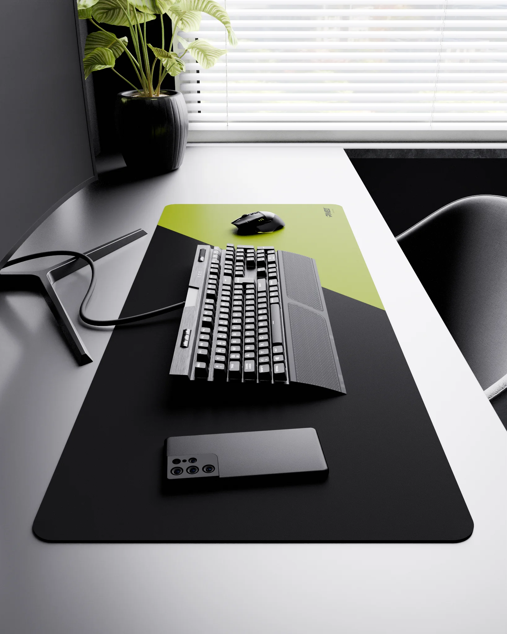 Side view of Toxic Edge Runner XXL deskmat 1000mm x 400mm right-handed layout on minimalist desk with gaming accessories, featuring light green diagonal split design, water-resistant easy-to-clean surface, ultra-lightweight and odour-free base.