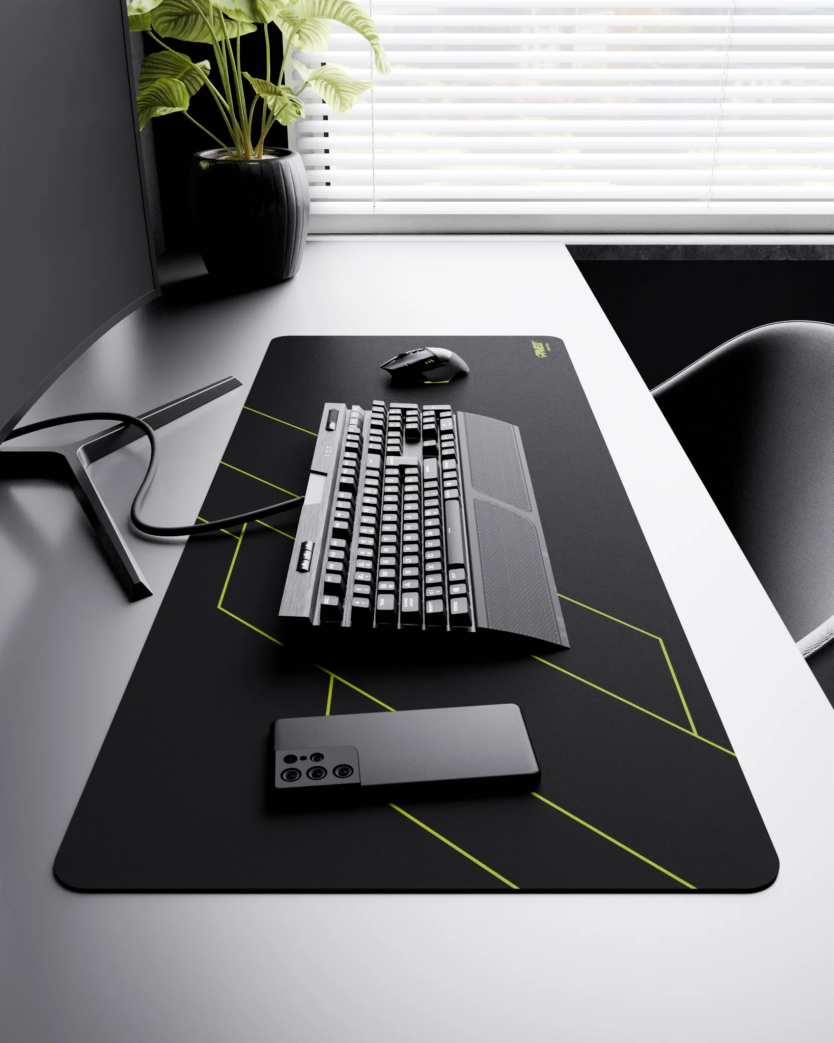 Side view of Night Toxic Formula XXL deskmat 1000mm x 400mm right-handed layout on minimalist desk with gaming accessories, featuring light green geometric angular line pattern, water-resistant easy-to-clean surface, ultra-lightweight and odour-free base.