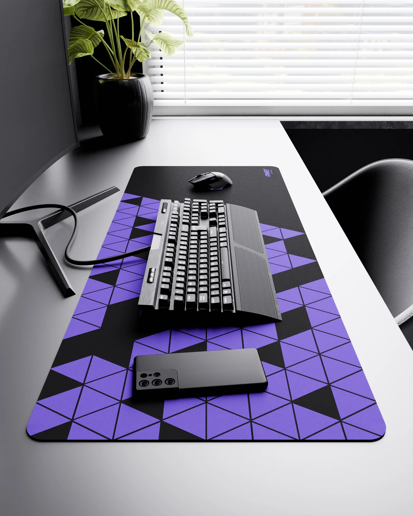 Side view of Night Amethyst Prism XXL deskmat 1000mm x 400mm right-handed layout on minimalist desk with gaming accessories, featuring purple geometric triangular prism pattern, water-resistant easy-to-clean surface, ultra-lightweight and odour-free base.