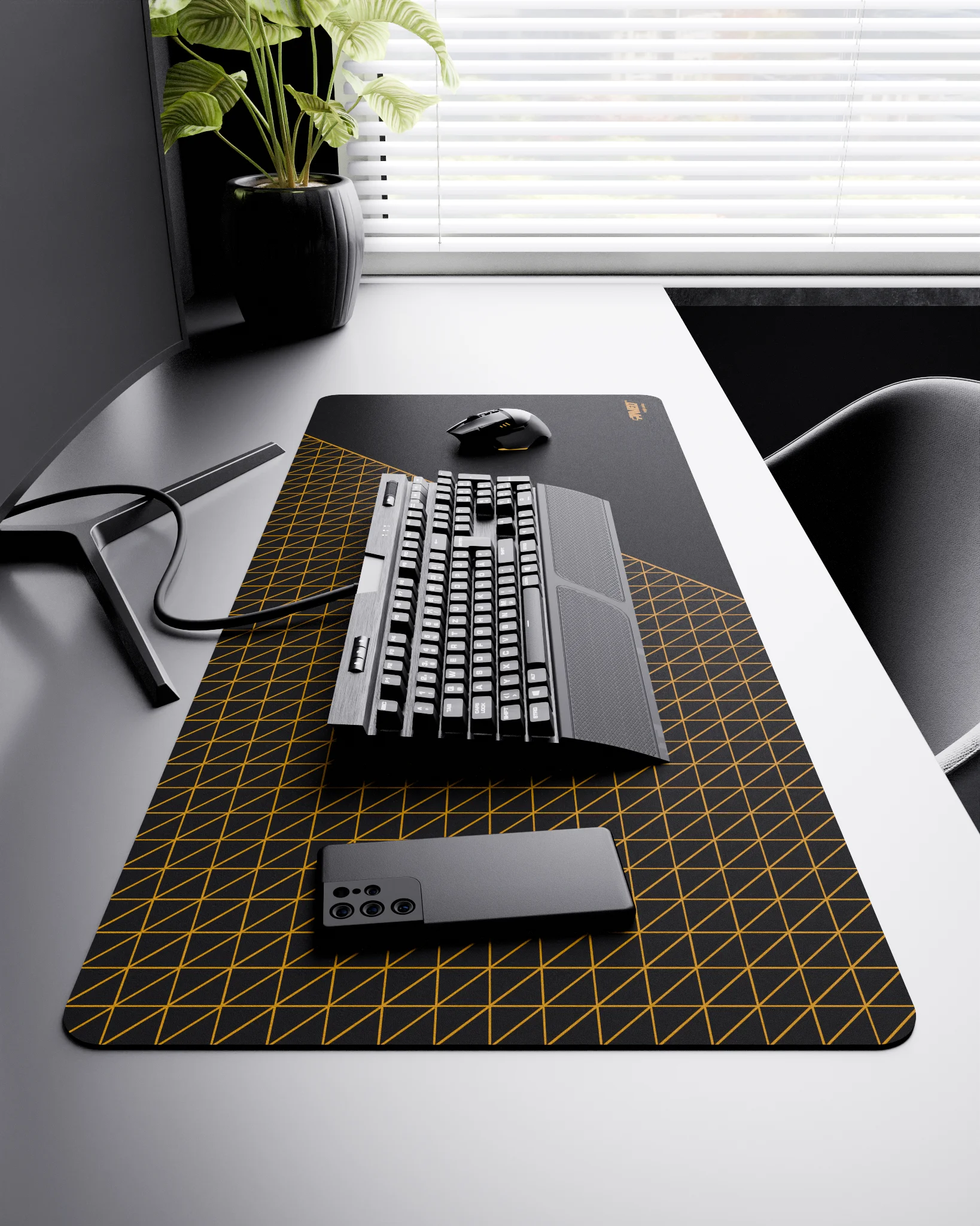 Side view of Night Desert Net Runner XXL deskmat 1000mm x 400mm right-handed layout on minimalist desk with gaming accessories, featuring deep yellow dense geometric net pattern, water-resistant easy-to-clean surface, ultra-lightweight and odour-free base.