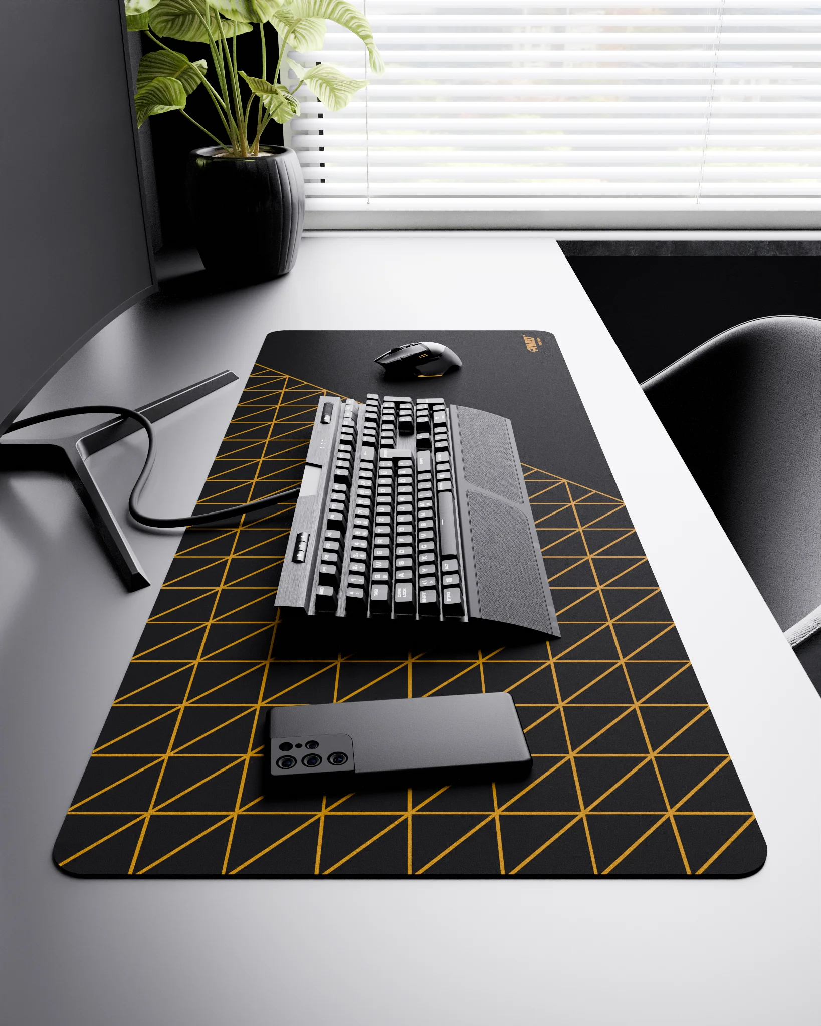 Side view of Night Desert Grid Runner XXL deskmat 1000mm x 400mm right-handed layout on minimalist desk with gaming accessories, featuring deep yellow geometric grid pattern, water-resistant easy-to-clean surface, ultra-lightweight and odour-free base.