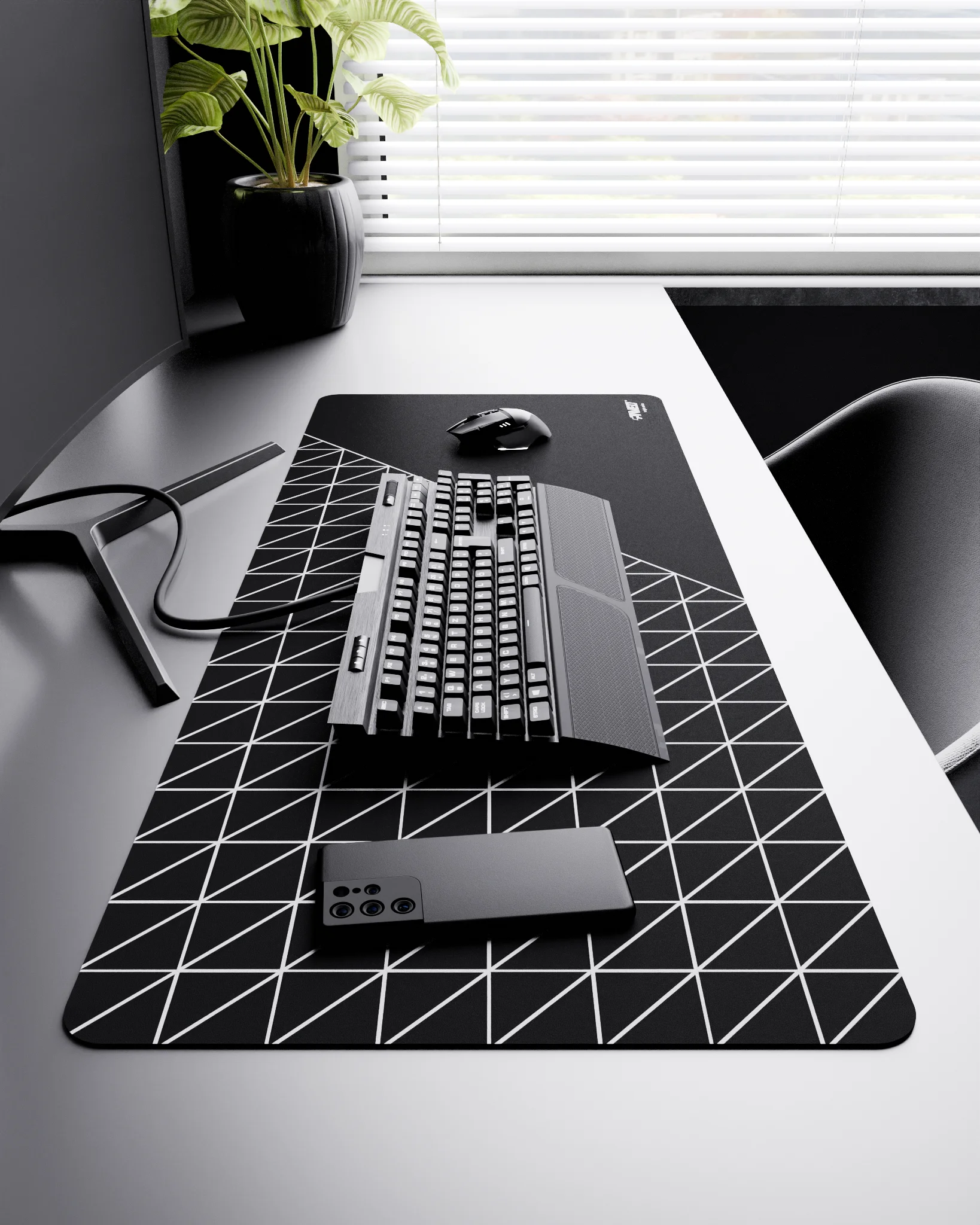 Side view of Night Grid Runner XXL deskmat 1000mm x 400mm right-handed layout on minimalist desk with gaming accessories, featuring white geometric grid pattern, water-resistant easy-to-clean surface, ultra-lightweight and odour-free base.