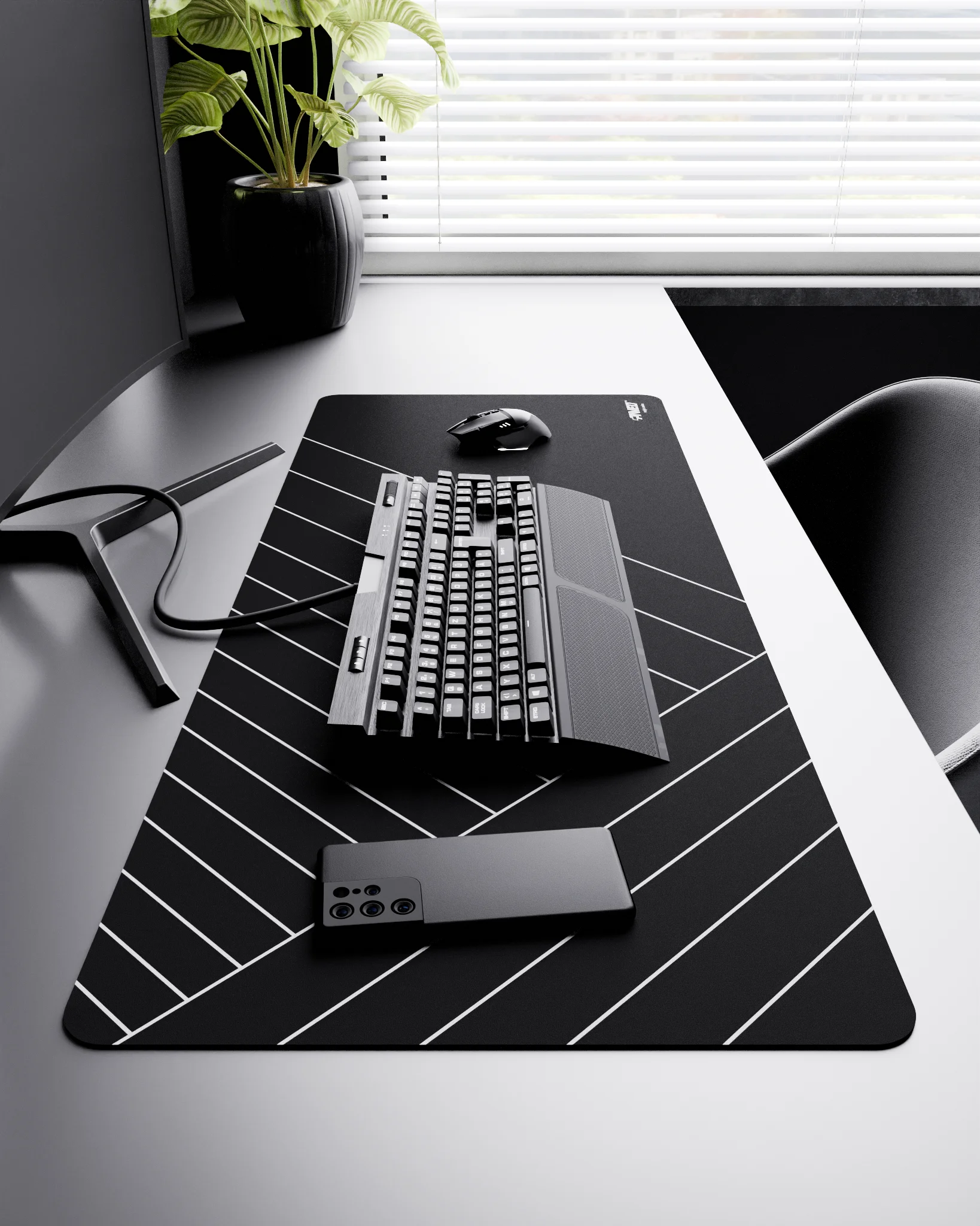 Side view of Night Zebra XXL deskmat 1000mm x 400mm right-handed layout on minimalist desk with gaming accessories, featuring white diagonal stripe pattern, water-resistant easy-to-clean surface, ultra-lightweight and odour-free base.