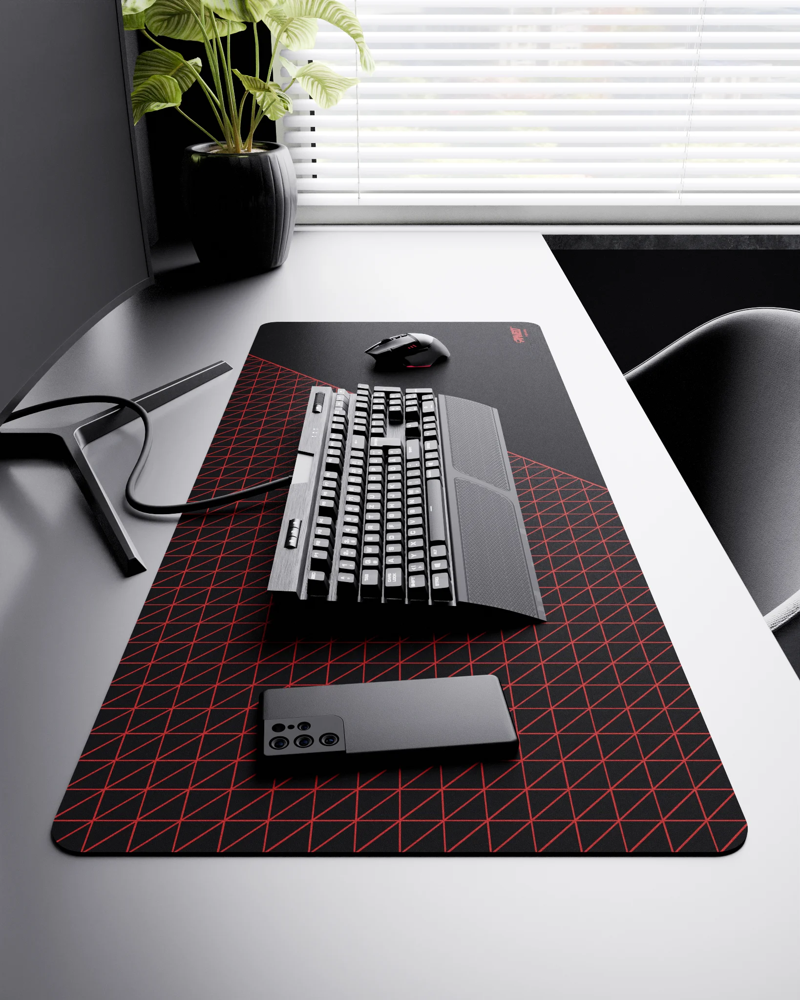 Side view of Night Imperial Net Runner XXL deskmat 1000mm x 400mm right-handed layout on minimalist desk with gaming accessories, featuring red dense geometric net pattern, water-resistant easy-to-clean surface, ultra-lightweight and odour-free base.