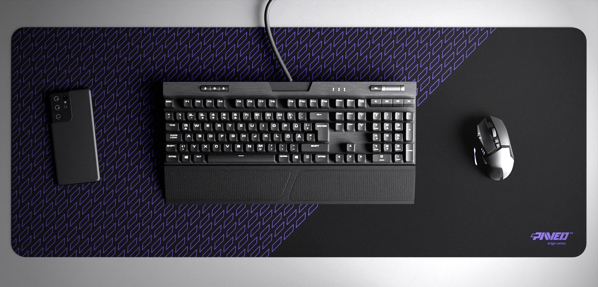 Top view of Night Amethyst Pathfinder XXL deskmat 1000mm x 400mm right-handed variant with minimalistic geometric tiled pattern in purple and black, hydrophobic easy-to-clean antimicrobial surface, shown with full-size mechanical keyboard, gaming mouse, and smartphone for scale, 600% lighter non-slip base with no rubbery smell, durable stitch-free edges.