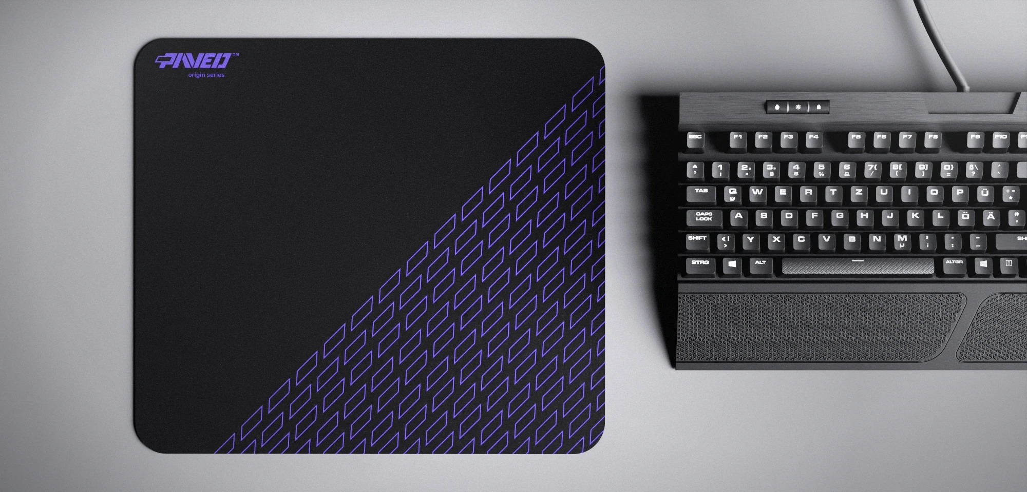 Top view of Night Amethyst Pathfinder M size mousepad 360mm x 320mm left-handed variant with minimalistic purple geometric tiled pattern on black background, water-resistant antimicrobial polyester surface, shown with full-size mechanical keyboard for scale, ultra-lightweight odour-free AreoFlex base, stitch-free edges.