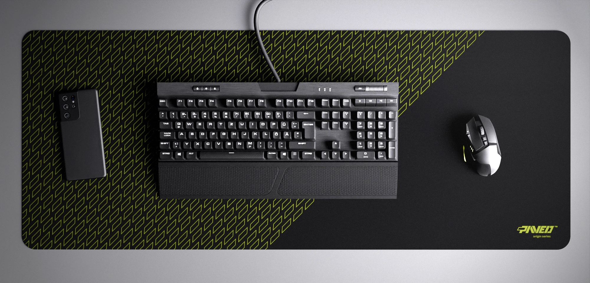 Top view of Night Toxic Pathfinder XXL deskmat 1000mm x 400mm right-handed variant with minimalistic geometric tiled pattern in light green and black, hydrophobic easy-to-clean antimicrobial surface, shown with full-size mechanical keyboard, gaming mouse, and smartphone for scale, 600% lighter non-slip base with no rubbery smell, durable stitch-free edges.