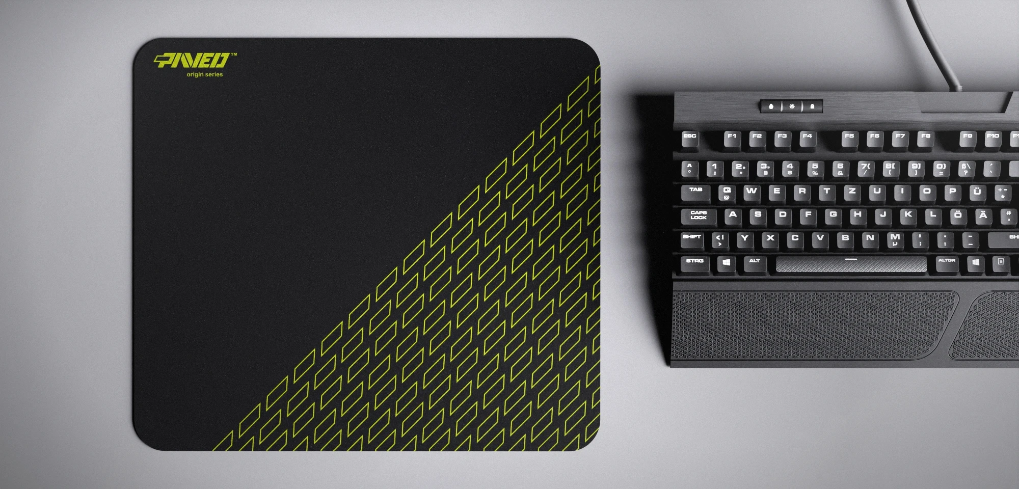Top view of Night Toxic Pathfinder M size mousepad 360mm x 320mm left-handed variant with minimalistic light green geometric tiled pattern on black background, water-resistant antimicrobial polyester surface, shown with full-size mechanical keyboard for scale, ultra-lightweight odour-free AreoFlex base, stitch-free edges.