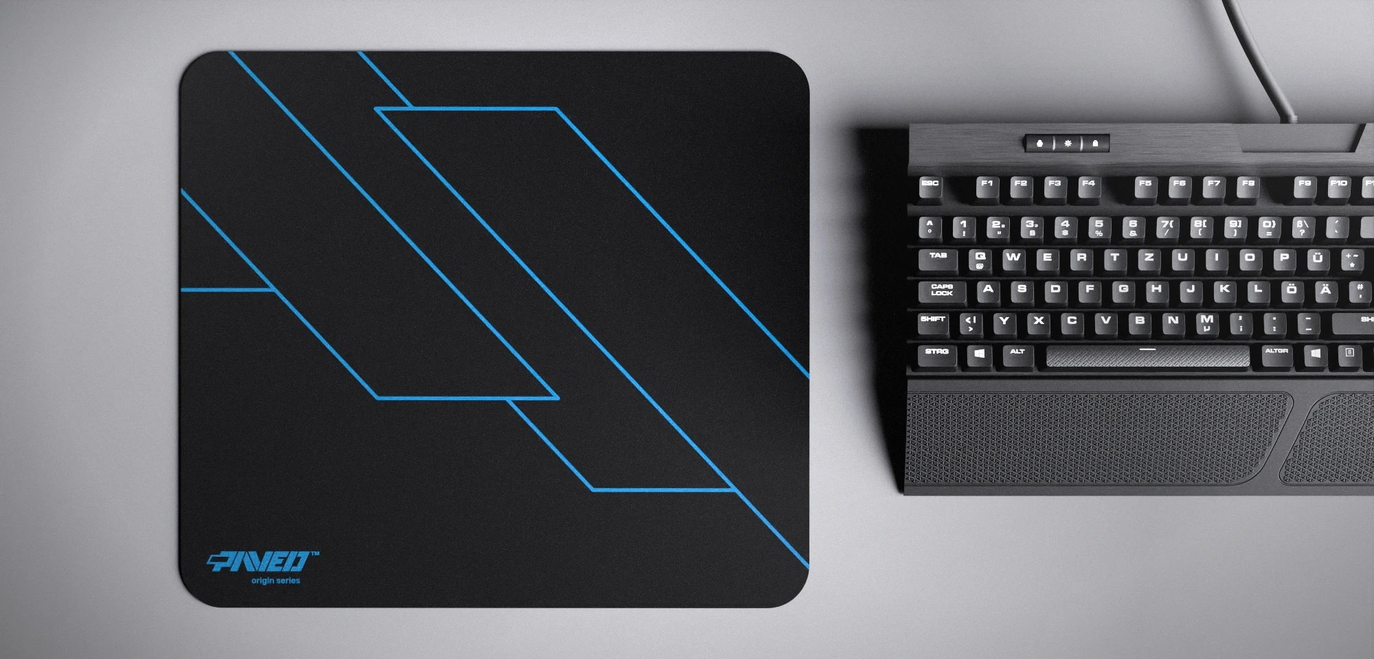 Top view of Night Sky Formula M size mousepad 360mm x 320mm left-handed variant with minimalistic blue geometric angular line pattern on black background, water-resistant antimicrobial polyester surface, shown with full-size mechanical keyboard for scale, ultra-lightweight odour-free AreoFlex base, stitch-free edges.