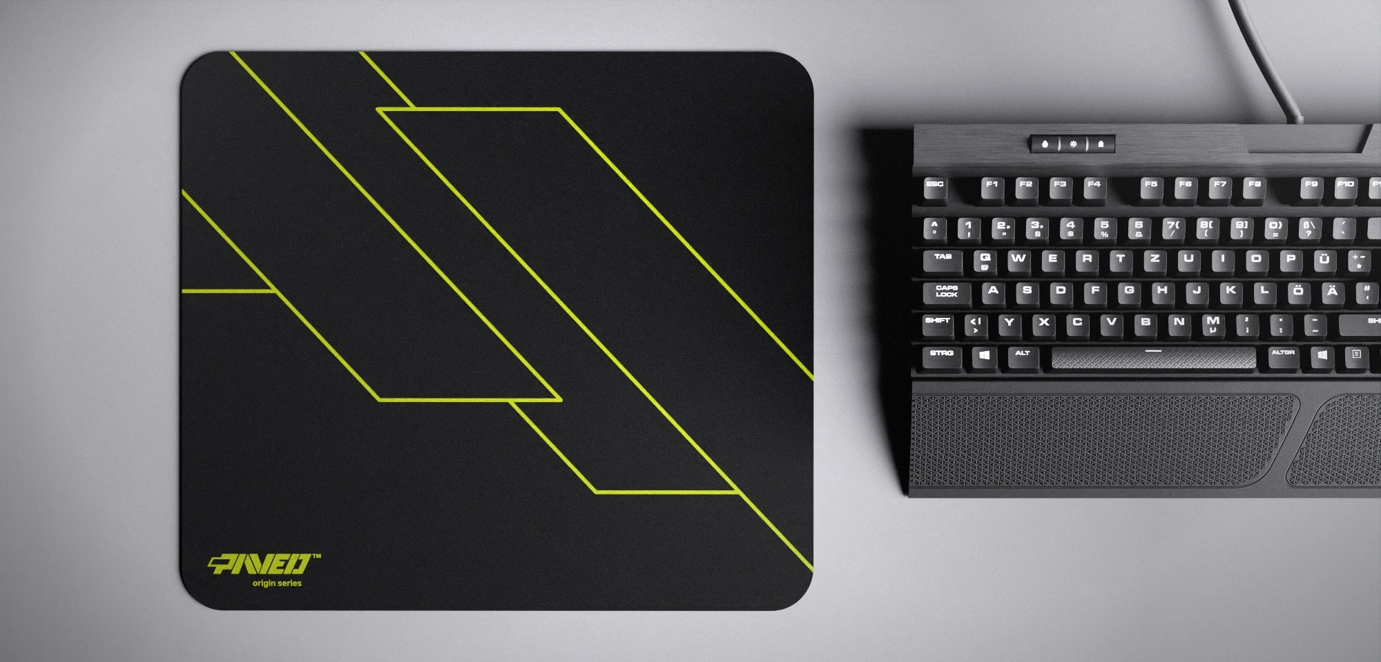 Top view of Night Toxic Formula M size mousepad 360mm x 320mm left-handed variant with minimalistic light green geometric angular line pattern on black background, water-resistant antimicrobial polyester surface, shown with full-size mechanical keyboard for scale, ultra-lightweight odour-free AreoFlex base, stitch-free edges.