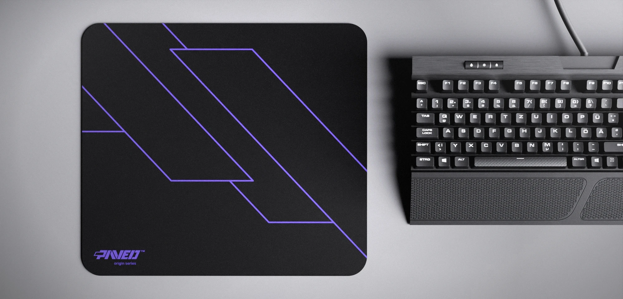 Top view of Night Amethyst Formula M size mousepad 360mm x 320mm left-handed variant with minimalistic purple geometric angular line pattern on black background, water-resistant antimicrobial polyester surface, shown with full-size mechanical keyboard for scale, ultra-lightweight odour-free AreoFlex base, stitch-free edges.