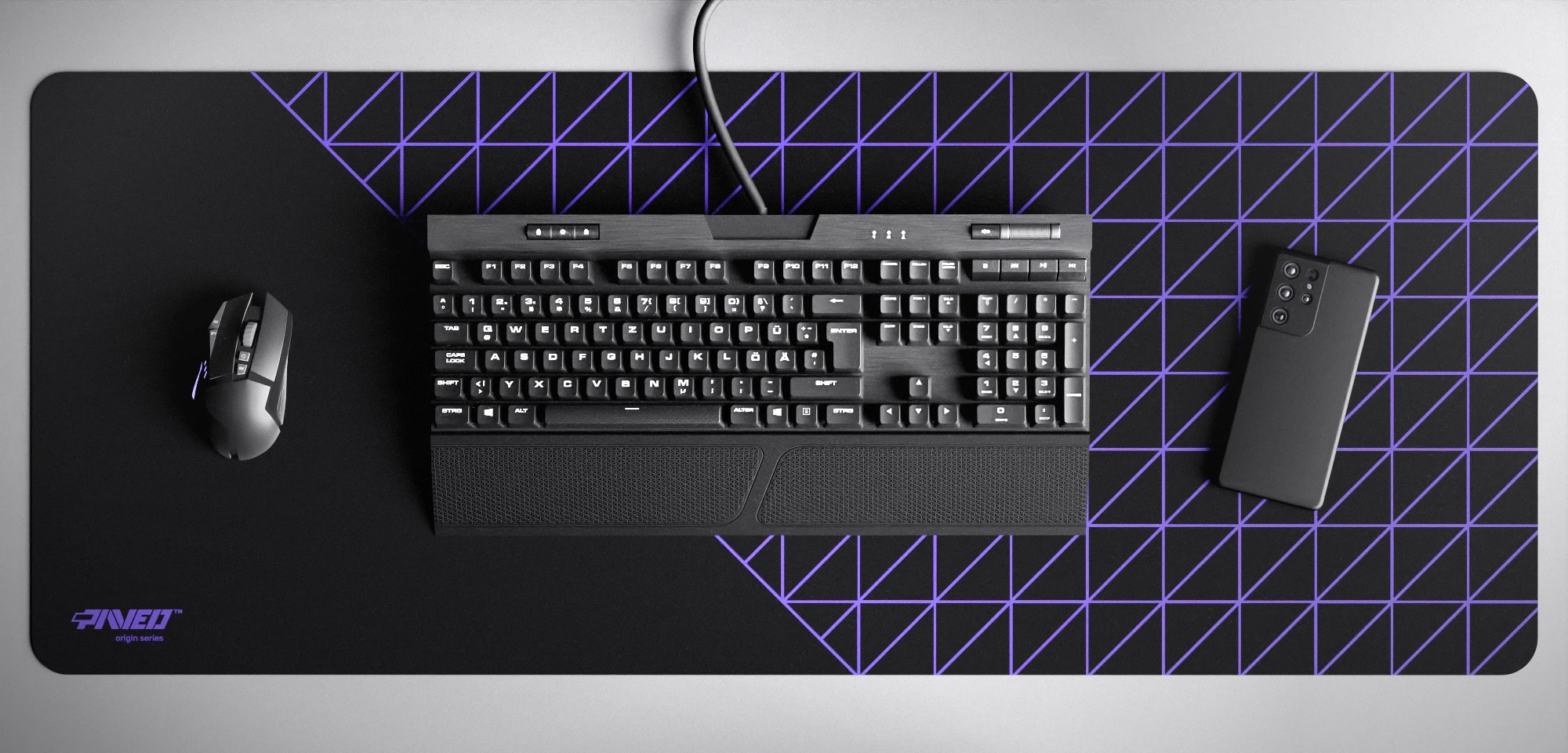 Top view of Night Amethyst Grid Runner XXL deskmat 1000mm x 400mm left-handed variant featuring geometric grid pattern in purple and black, water-resistant antimicrobial polyester surface, shown with full-size mechanical keyboard, gaming mouse, and smartphone for scale, ultra-lightweight odour-free AreoFlex microruber base, stitch-free professional finish.