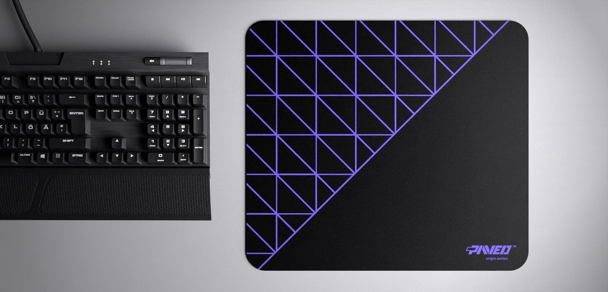 Top view of Night Amethyst Grid Runner M size mousepad 360mm x 320mm right-handed variant with geometric grid pattern in purple and black, hydrophobic easy-to-clean surface with antimicrobial properties, shown with full-size mechanical keyboard for scale, 600% lighter with no rubbery odour base, durable stitch-free finish.