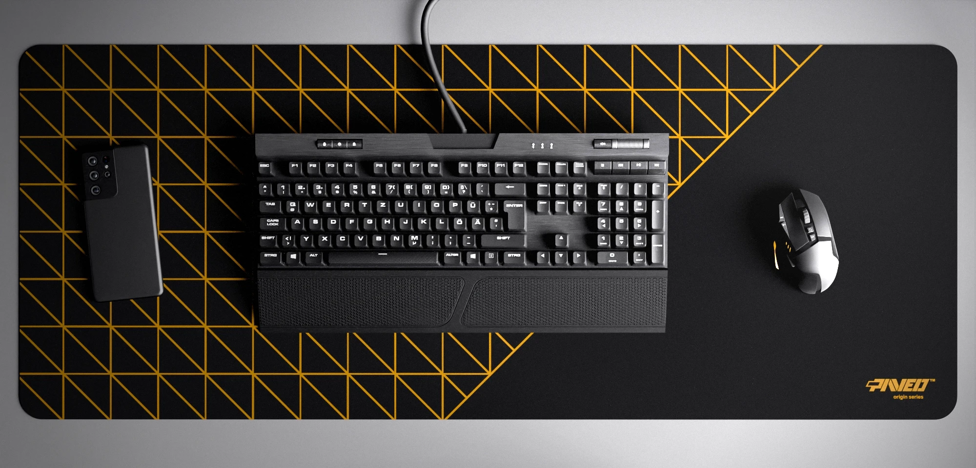 Top view of Night Desert Grid Runner XXL deskmat 1000mm x 400mm right-handed variant with minimalistic geometric grid pattern in deep yellow and black, hydrophobic easy-to-clean antimicrobial surface, shown with full-size mechanical keyboard, gaming mouse, and smartphone for scale, 600% lighter non-slip base with no rubbery smell, durable stitch-free edges.