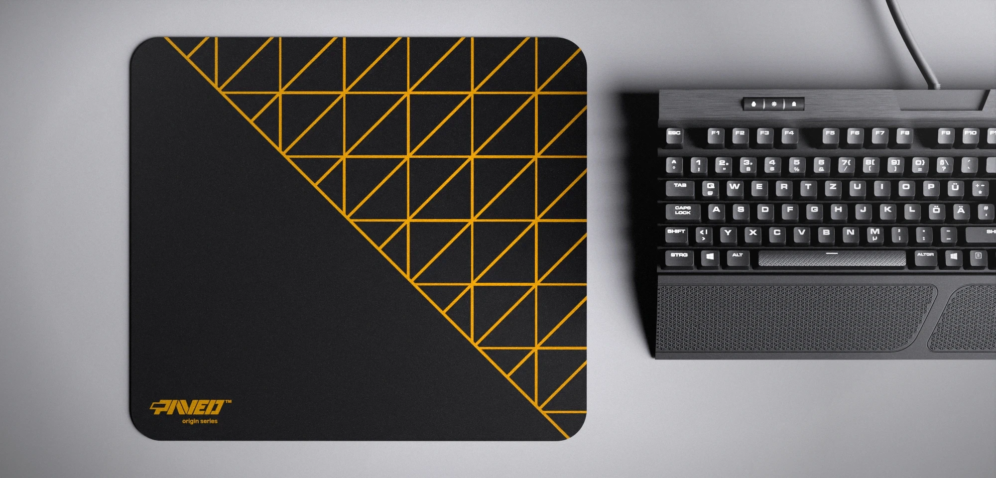 Top view of Night Desert Grid Runner M size mousepad 360mm x 320mm left-handed variant with minimalistic deep yellow geometric grid pattern on black background, water-resistant antimicrobial polyester surface, shown with full-size mechanical keyboard for scale, ultra-lightweight odour-free AreoFlex base, stitch-free edges.
