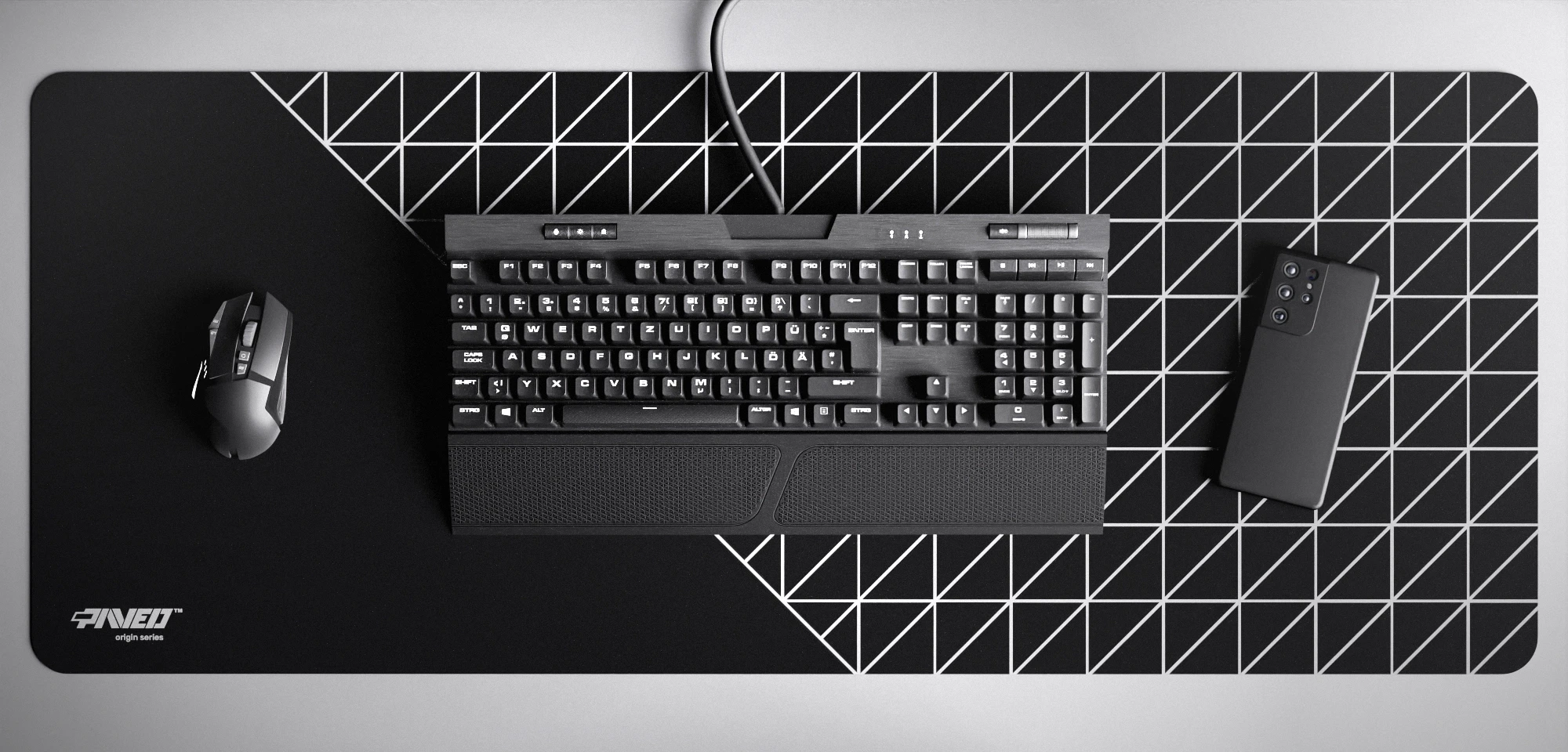 Top view of Night Grid Runner XXL deskmat 1000mm x 400mm left-handed variant featuring geometric grid pattern in white and black, water-resistant antimicrobial polyester surface, shown with full-size mechanical keyboard, gaming mouse, and smartphone for scale, ultra-lightweight odour-free AreoFlex microruber base, stitch-free professional finish.