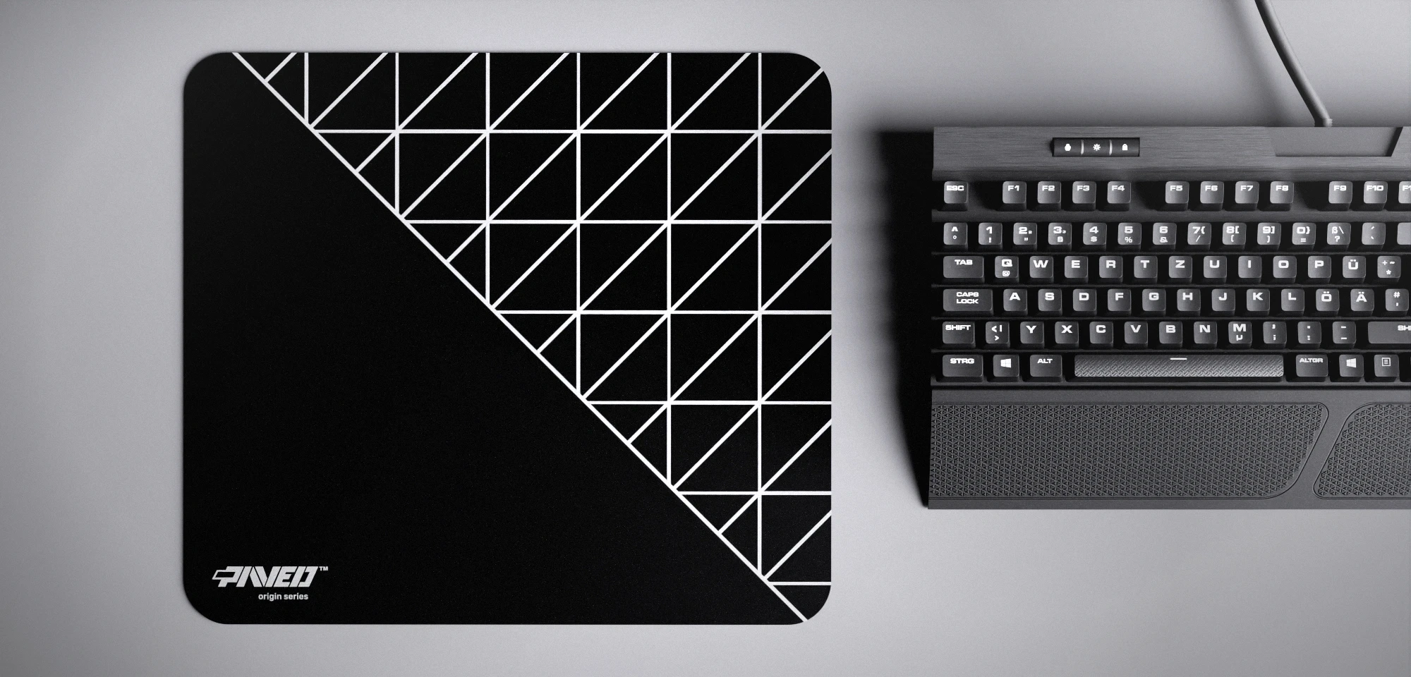 Top view of Night Grid Runner M size mousepad 360mm x 320mm left-handed variant with minimalistic white geometric grid pattern on black background, water-resistant antimicrobial polyester surface, shown with full-size mechanical keyboard for scale, ultra-lightweight odour-free AreoFlex base, stitch-free edges.