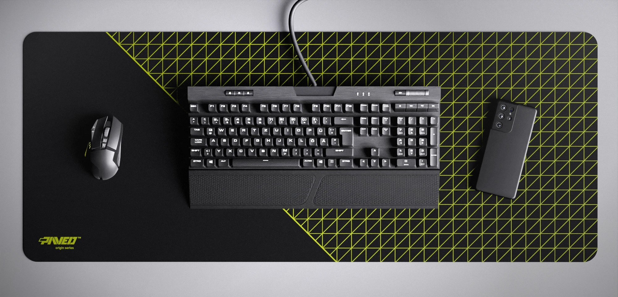 Top view of Night Toxic Net Runner XXL deskmat 1000mm x 400mm left-handed variant featuring dense geometric net pattern in light green and black, water-resistant antimicrobial polyester surface, shown with full-size mechanical keyboard, gaming mouse, and smartphone for scale, ultra-lightweight odour-free AreoFlex microruber base, stitch-free professional finish.