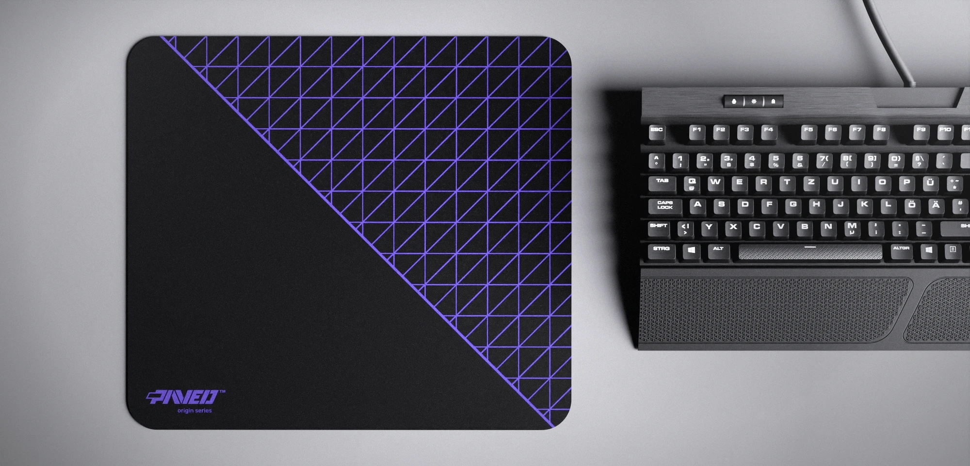Top view of Night Amethyst Net Runner M size mousepad 360mm x 320mm left-handed variant with minimalistic purple dense geometric net pattern on black background, water-resistant antimicrobial polyester surface, shown with full-size mechanical keyboard for scale, ultra-lightweight odour-free AreoFlex base, stitch-free edges.