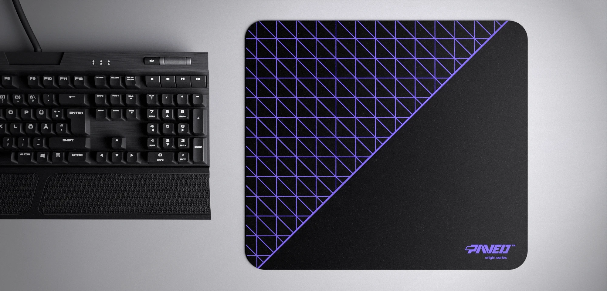 Top view of Night Amethyst Net Runner M size mousepad 360mm x 320mm right-handed variant with dense geometric net pattern in purple and black, hydrophobic easy-to-clean surface with antimicrobial properties, shown with full-size mechanical keyboard for scale, 600% lighter with no rubbery odour base, durable stitch-free finish.