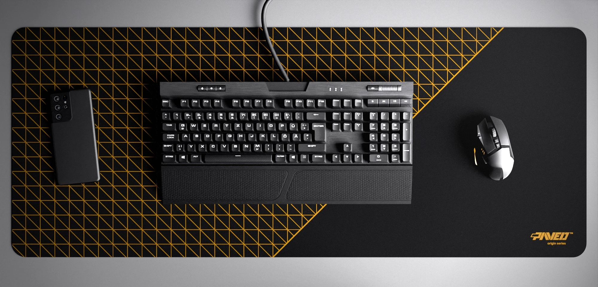 Top view of Night Desert Net Runner XXL deskmat 1000mm x 400mm right-handed variant with minimalistic dense geometric net pattern in deep yellow and black, hydrophobic easy-to-clean antimicrobial surface, shown with full-size mechanical keyboard, gaming mouse, and smartphone for scale, 600% lighter non-slip base with no rubbery smell, durable stitch-free edges.